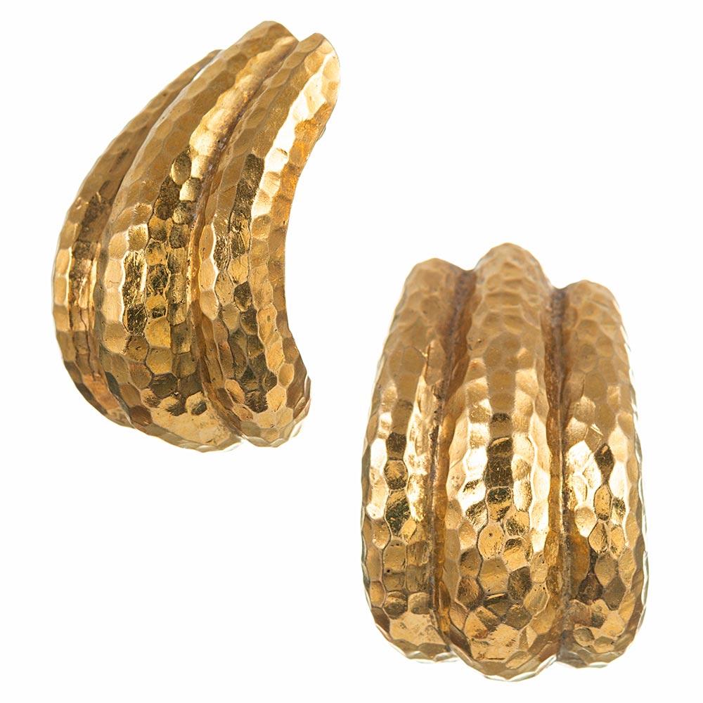 The hammered texture of these golden ear clips reflects light and creates an alluring organic texture. Sophisticated and wearable for all occasions, the absence of gemstones allow these earrings to be easily paired with other pieces. 1.25 inches