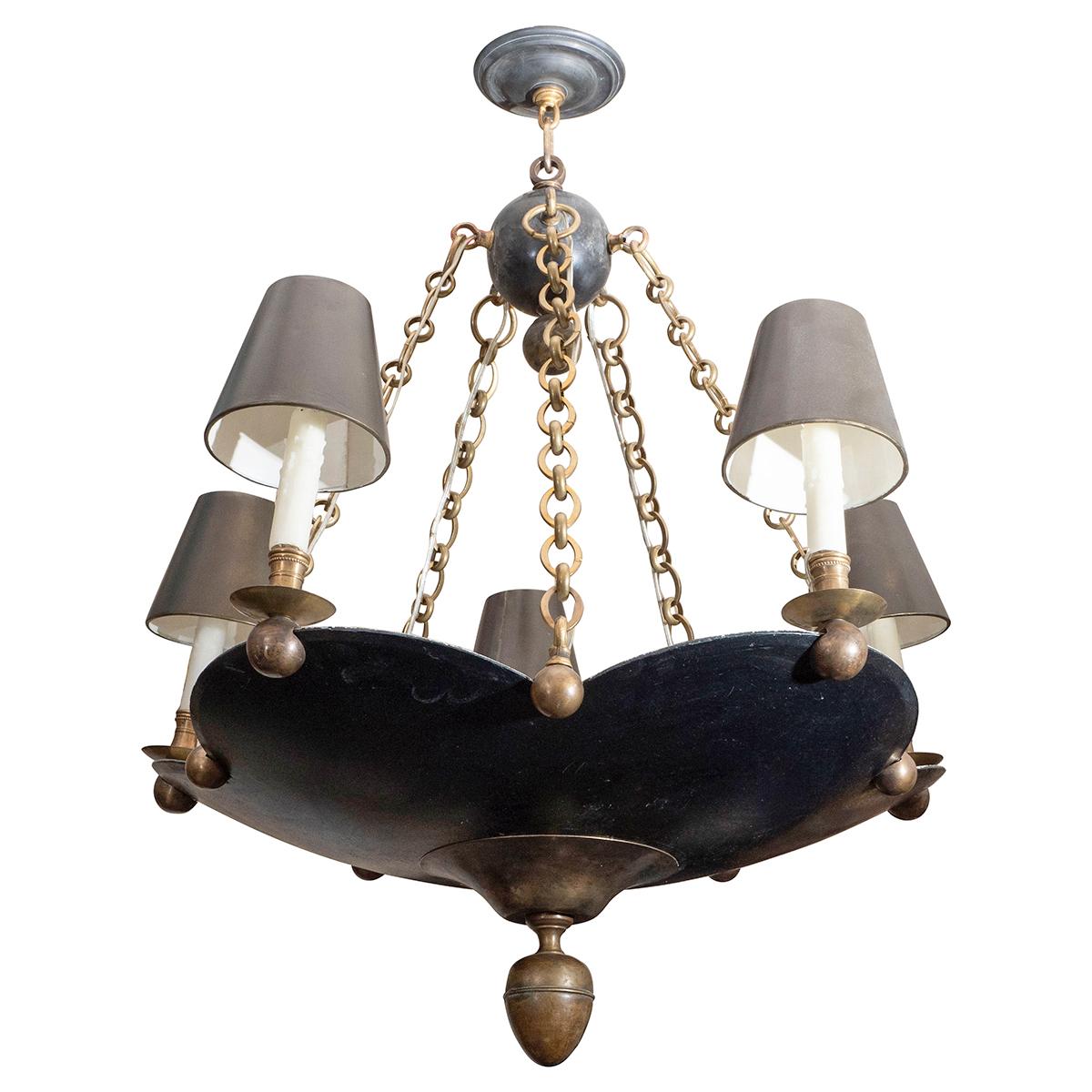 Rare hammered iron and brass flower-shaped chandelier with original conical enameled metal shades.