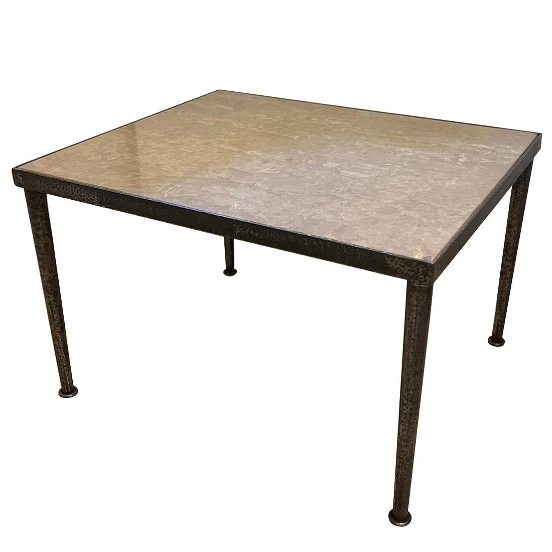 An Italian circa 1950's hammered iron side table with marble inset.

Measurements:
Height: 17.5