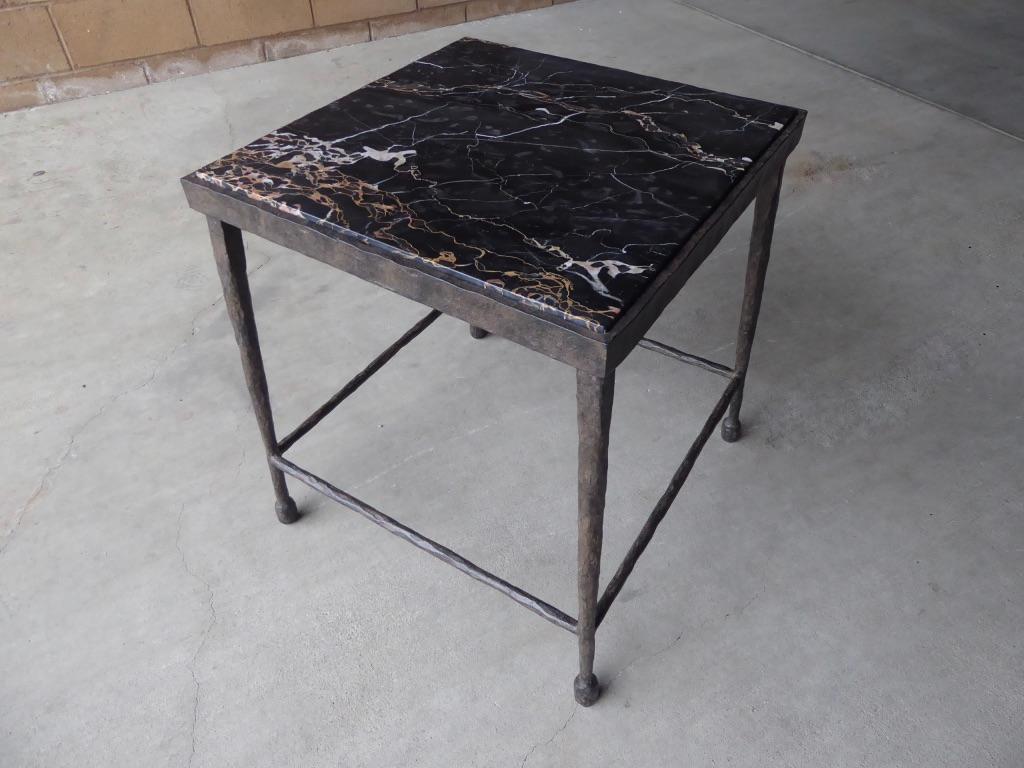 A contemporary square hammered iron side table with an inset black Portoro marble top. The table was custom made for a design project in Los Angeles.
 