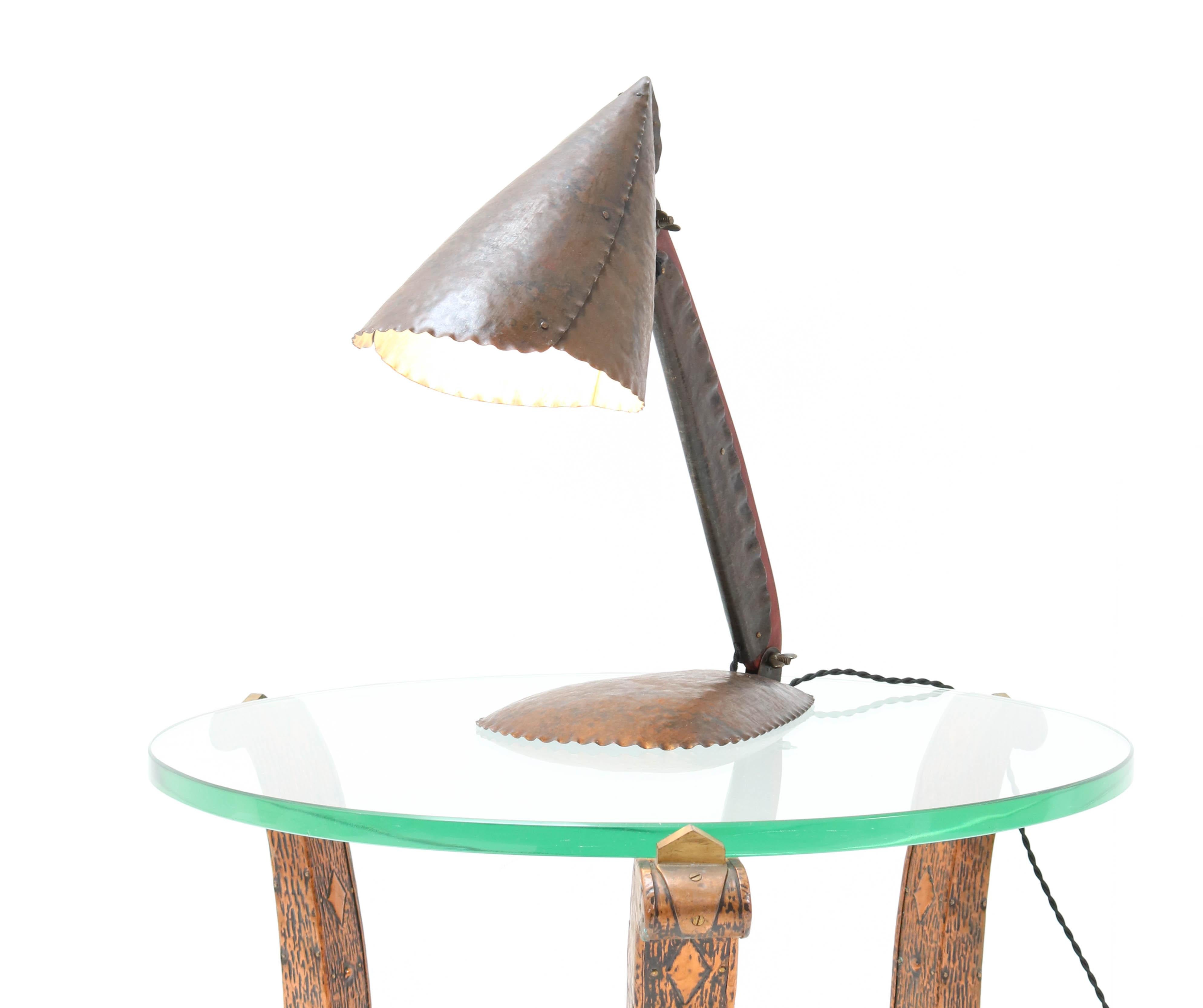 Magnificent and rare Art Deco Amsterdam School table lamp.
Design by Johan Verhey Rotterdam.
Striking Dutch design from the 1930s.
Patinated hammered metal and mahogany stained wood.
Rewired with one socket for E27 light bulb.
In very good