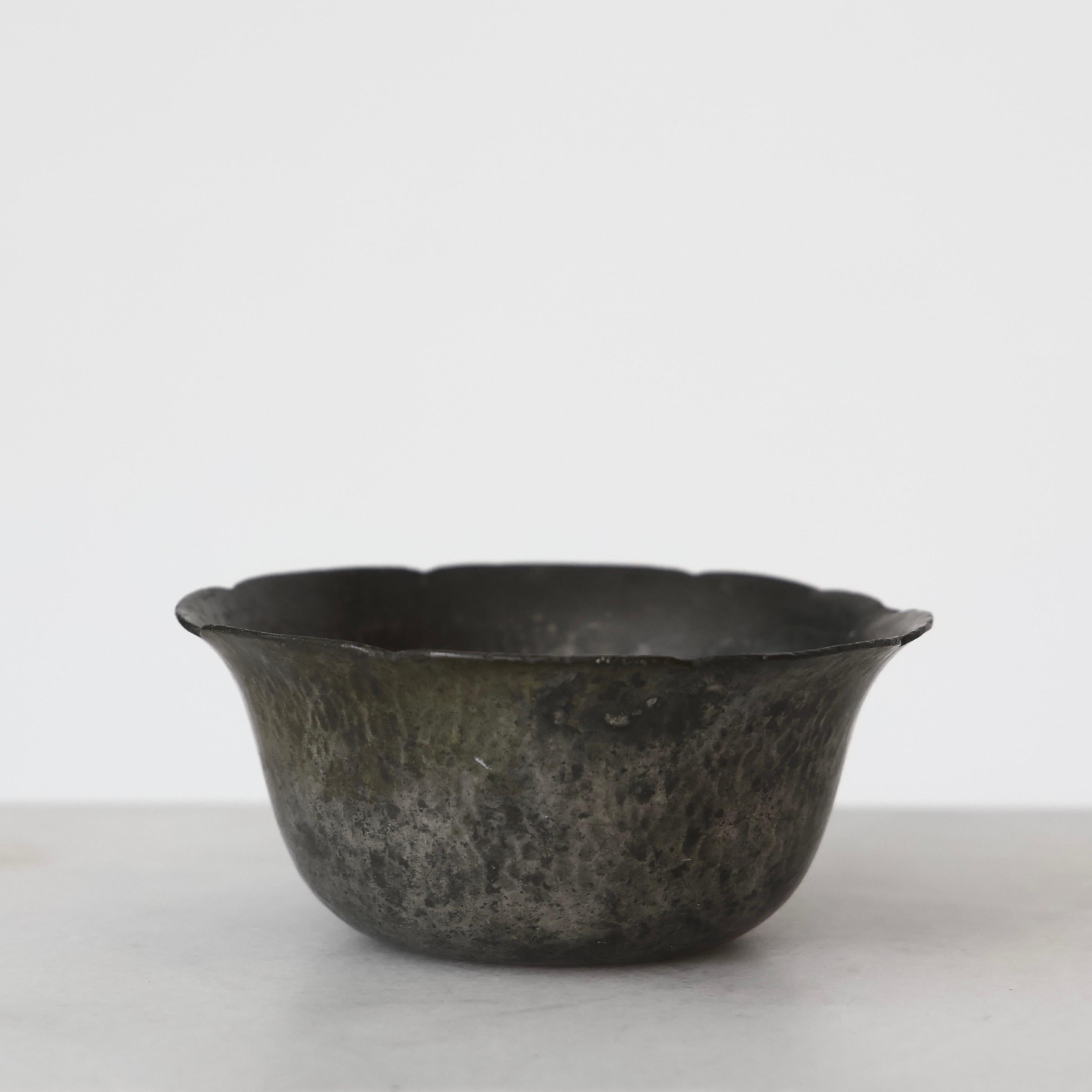Hammered Pewter Bowl made by Just Andersen in the early 1920s. A fine piece for a beautiful place.

* Round bowl in hammered pewter
* Designer: Just Andersen
* Model: 54
* Year: 1918-1920s
* Condition: Fair vintage condition. Makers engraving