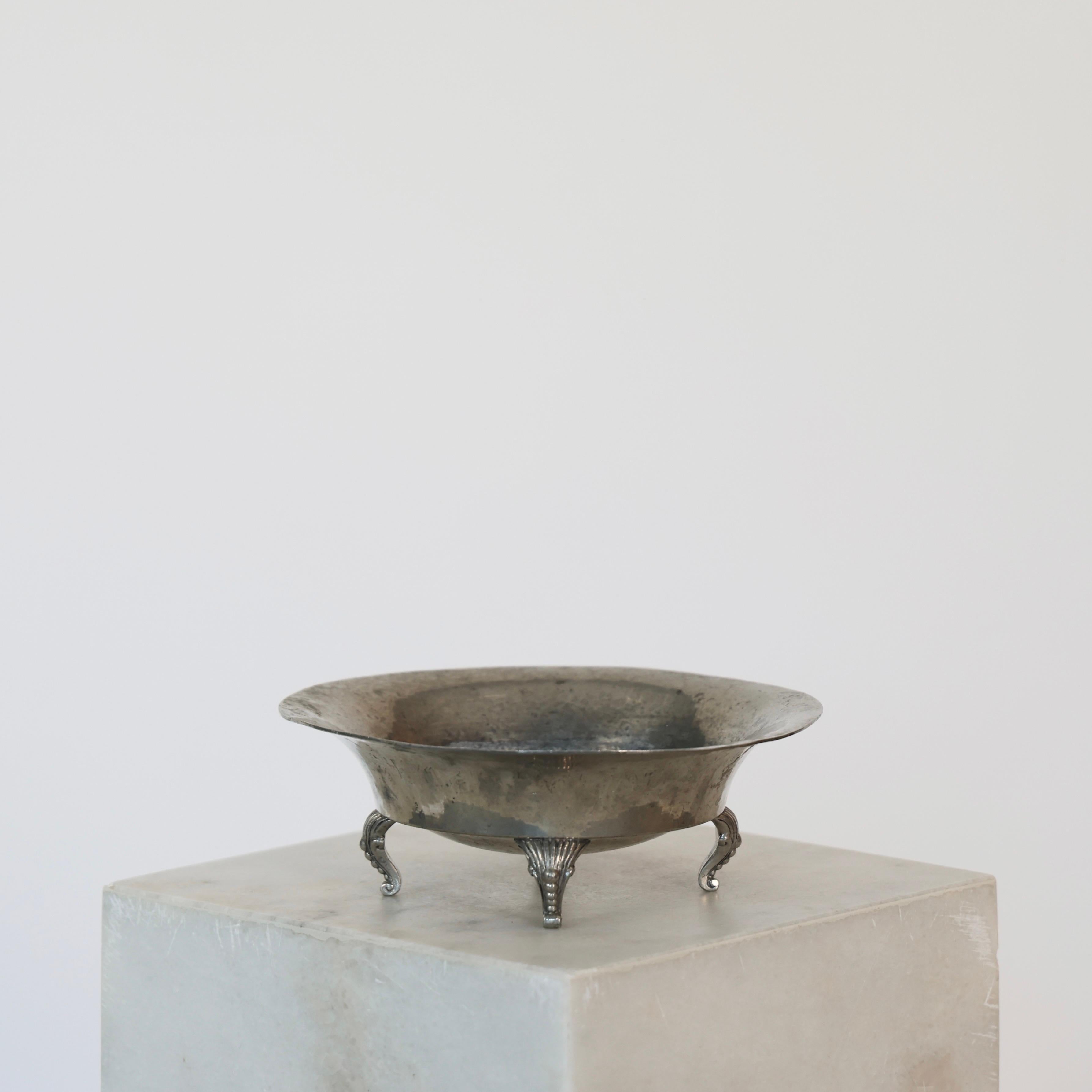 Pewter Bowl on Legs designed by Just Andersen in the 1920s. A fine little piece for an exquisite place.

* Hammered Pewter bowl on four legs
* Designer: Just Andersen
* Model: 431
* Year: 1918-1929
* Condition: Fair vintage condition. Makers