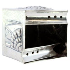 Hammered silver ashtray with cube-shaped reliefs and two cigarette holders