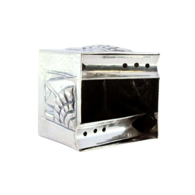 Hammered silver ashtray with cube-shaped reliefs and two cigarette holders
