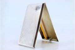 Hammered silver case with gold interior, two holder straps, hinged lid
