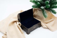 Hammered silver chest-shaped jewelry box with blue velvet lining