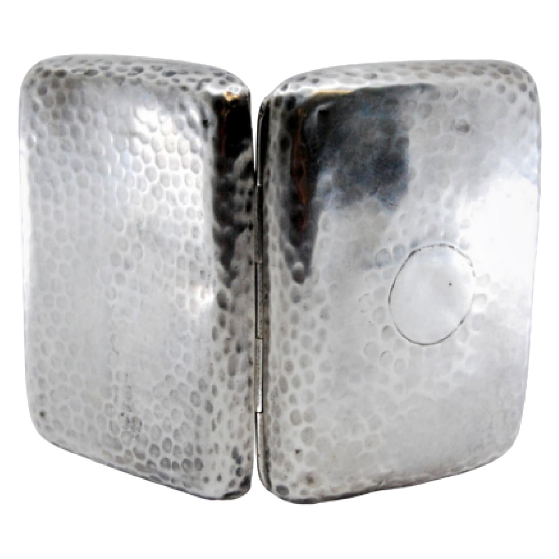 Hammered silver cigarette case with monogram card, gold interior and hinged lid