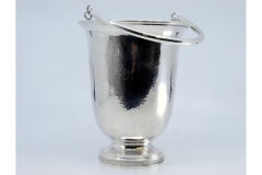 Hammered silver ice bucket with base trim and movable handle