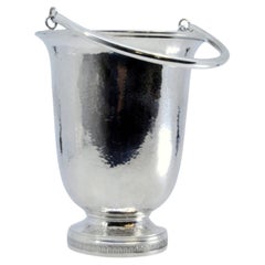 Hammered silver ice bucket with base trim and movable handle
