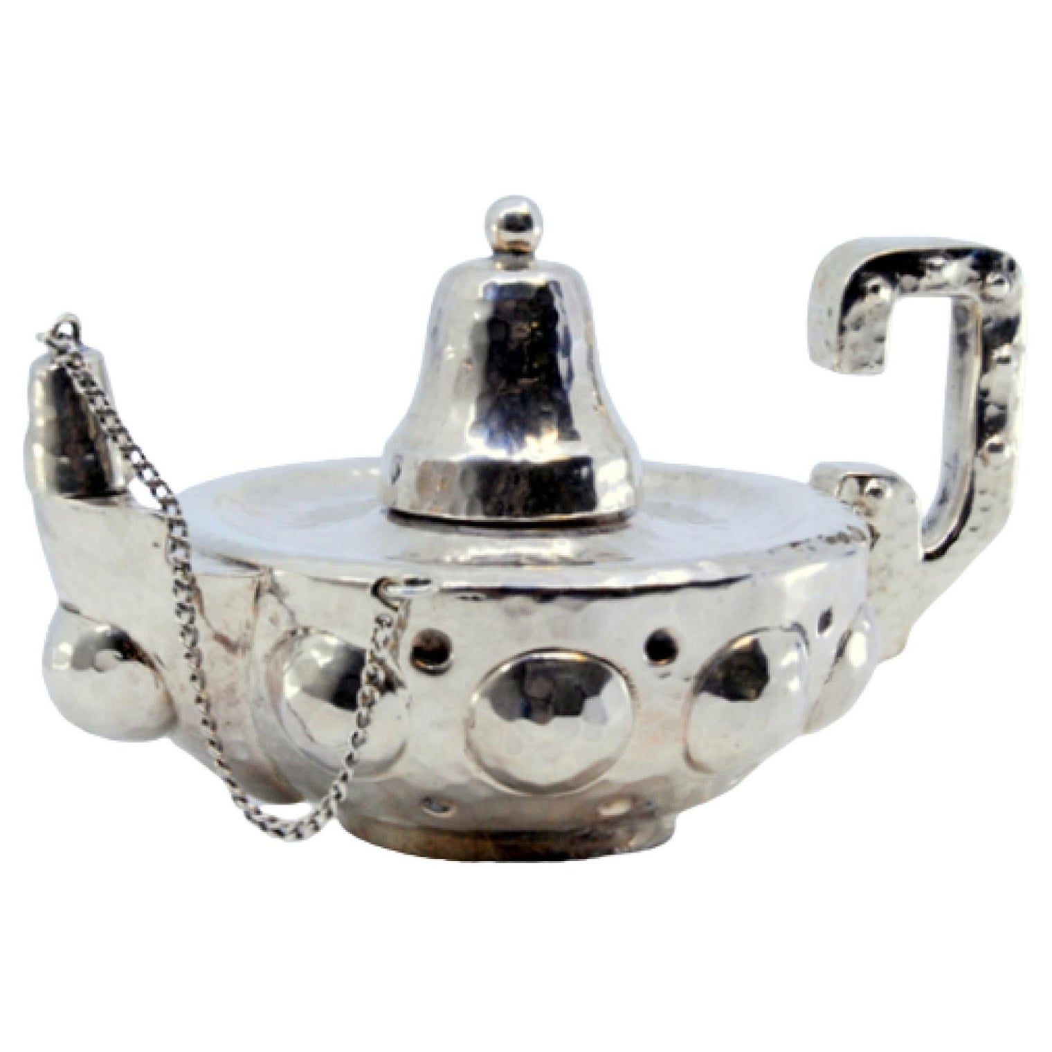 Hammered silver lamp with reliefs on the casing and knob on the lid