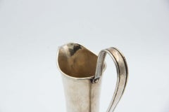 Hammered silver wine jug with fixed handle