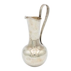Hammered silver wine jug with fixed handle