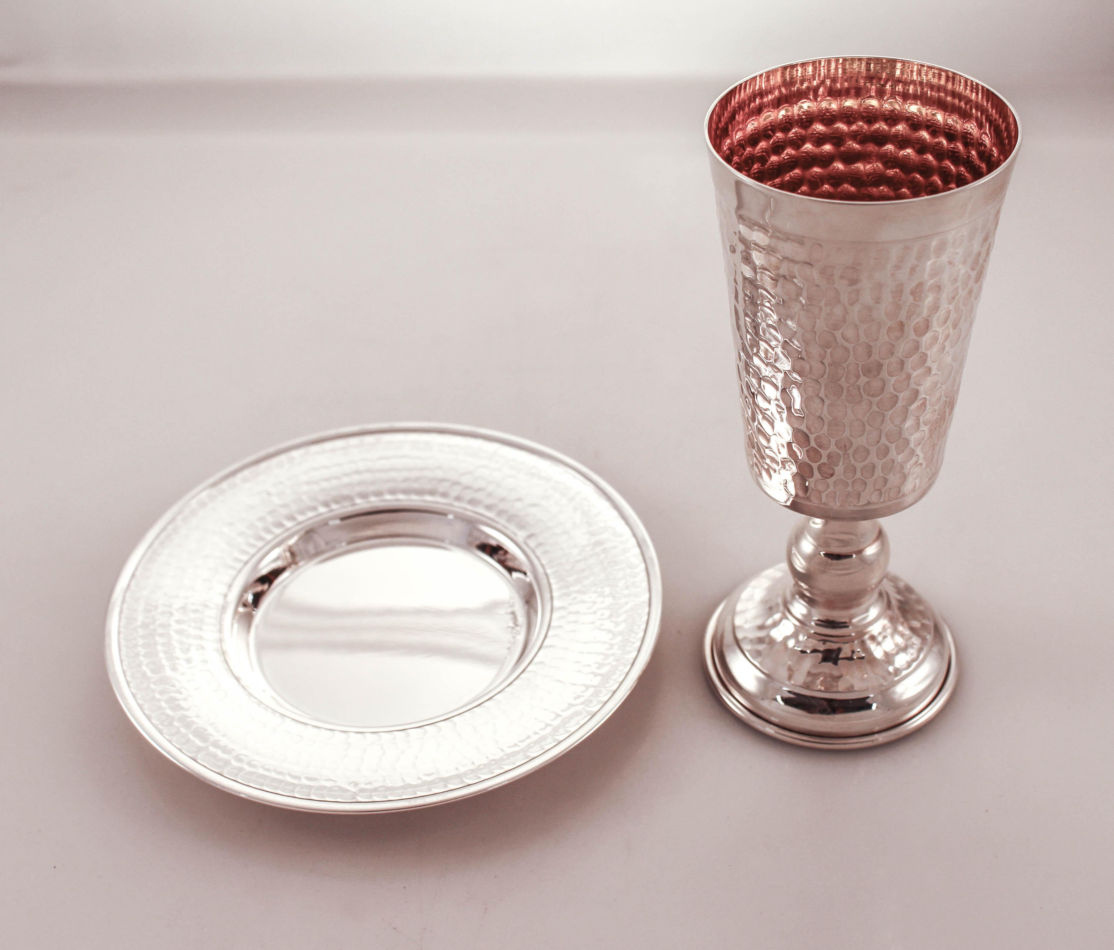 A sterling silver Kiddush cup and matching plate in a hammered design. Bold, masculine and contemporary; a much-needed change from the super ornate Judaica we’ve seen over the years.