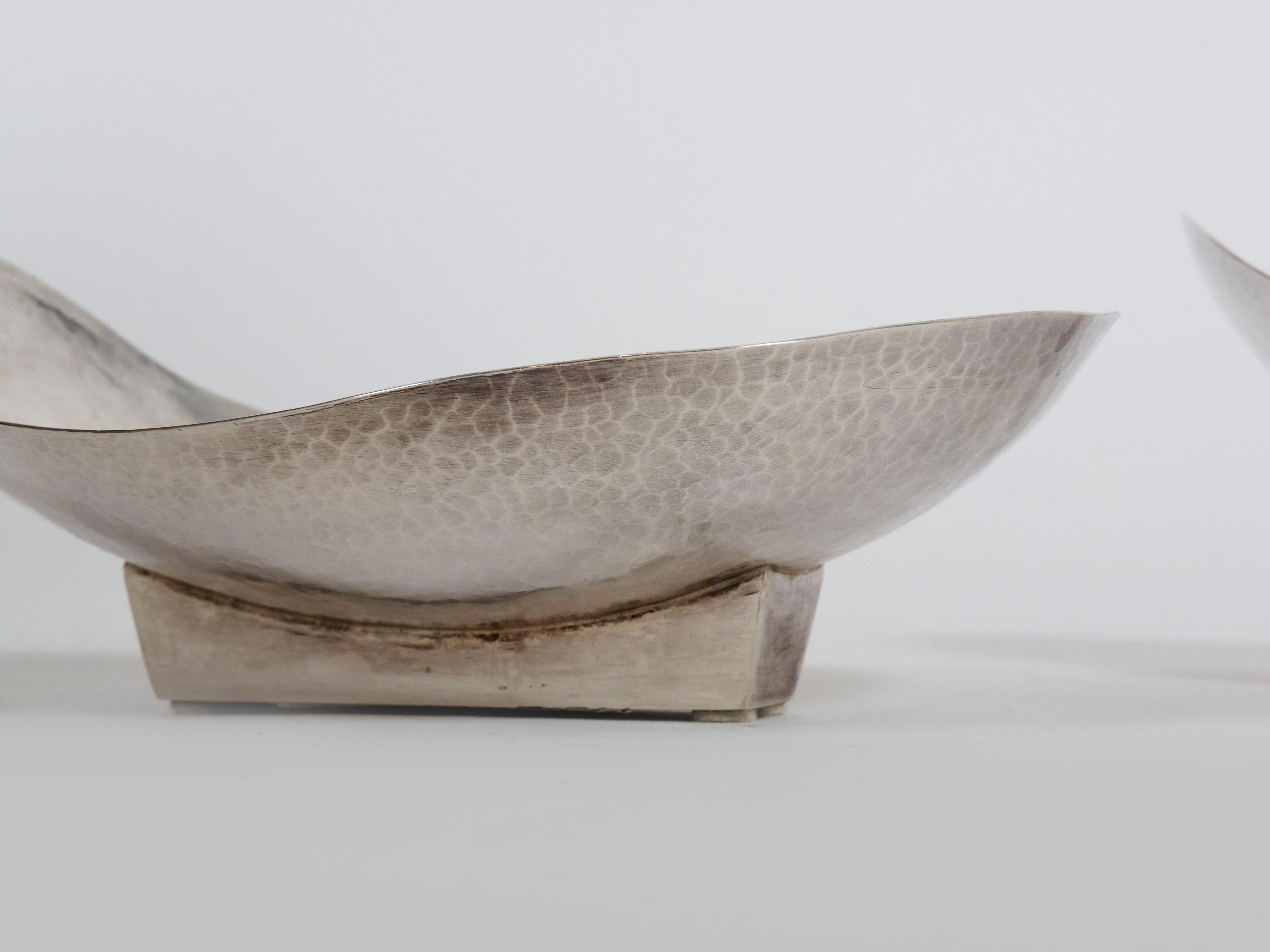Offered are artisan-crafted hammered sterling silver candy bowls made in Italy. 

They are different in size and priced separately (the listed price being for the largest of the two available). 

The larger bowl measures 10