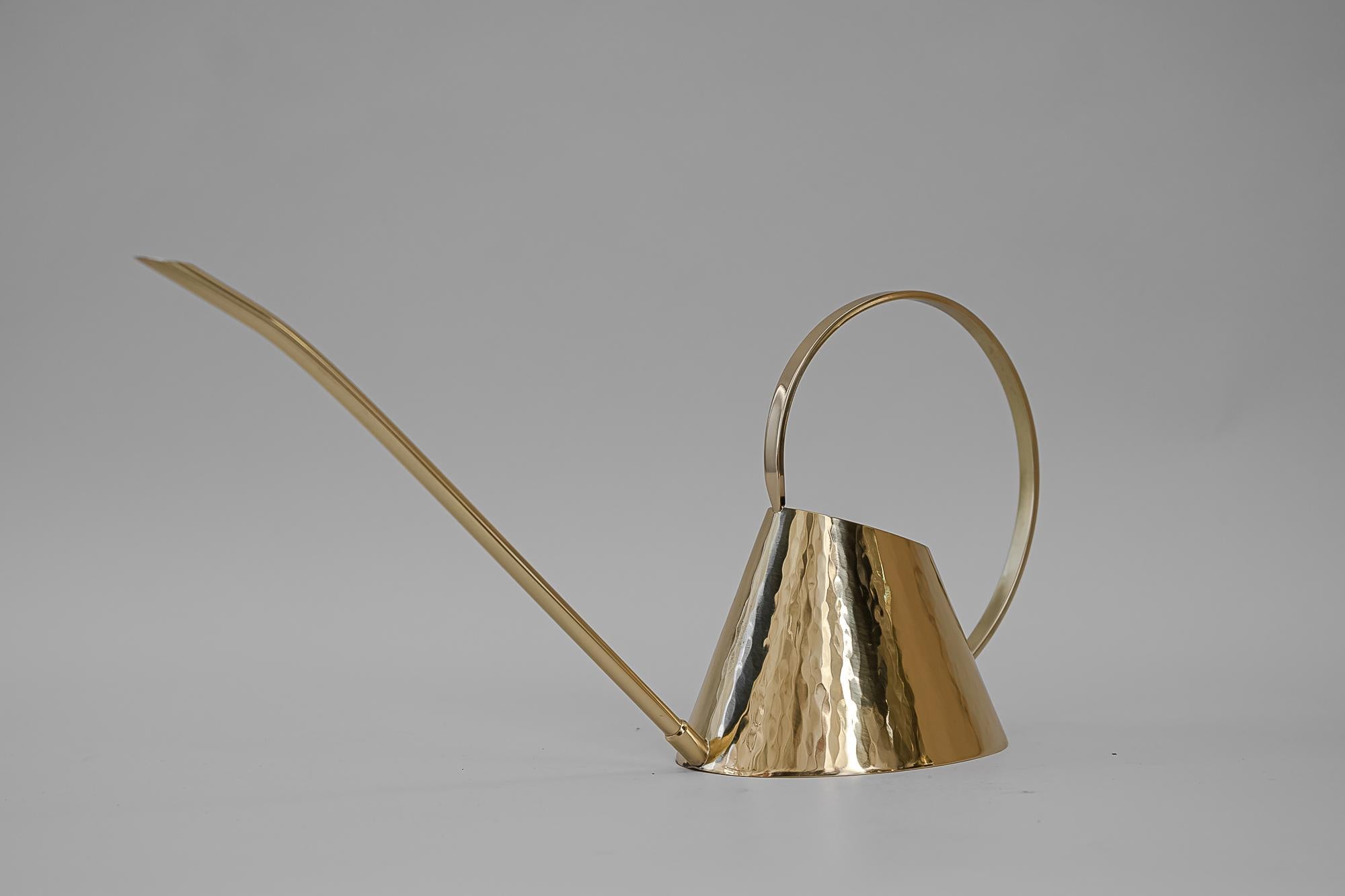 Hammered watering can, circa 1950s
Polished and stove enameled.
