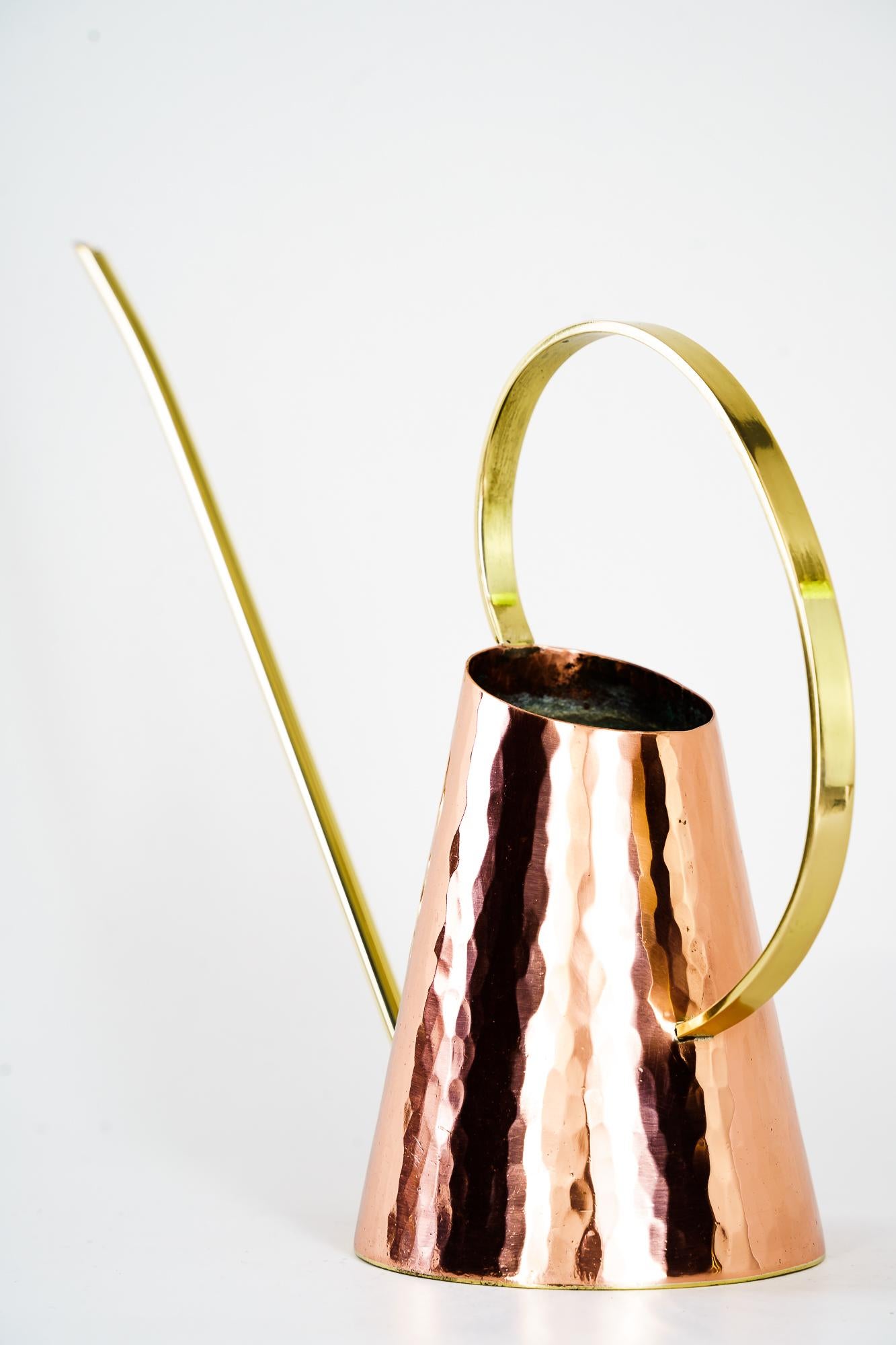 Hammered Watering Can, circa 1950s
Copper and brass combination
Polished and stove enamelled
Very nice design.