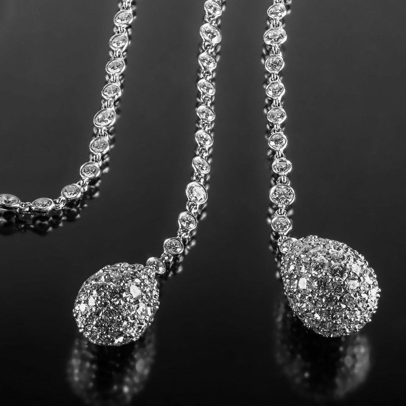 Designed and made by Hammerman Brothers in New York City, this dazzling long-chain lariat is encrusted with approximately 22.59 carats of round brilliant diamonds. At a generous 38 inches, it can be wrapped around the neck several times to create a