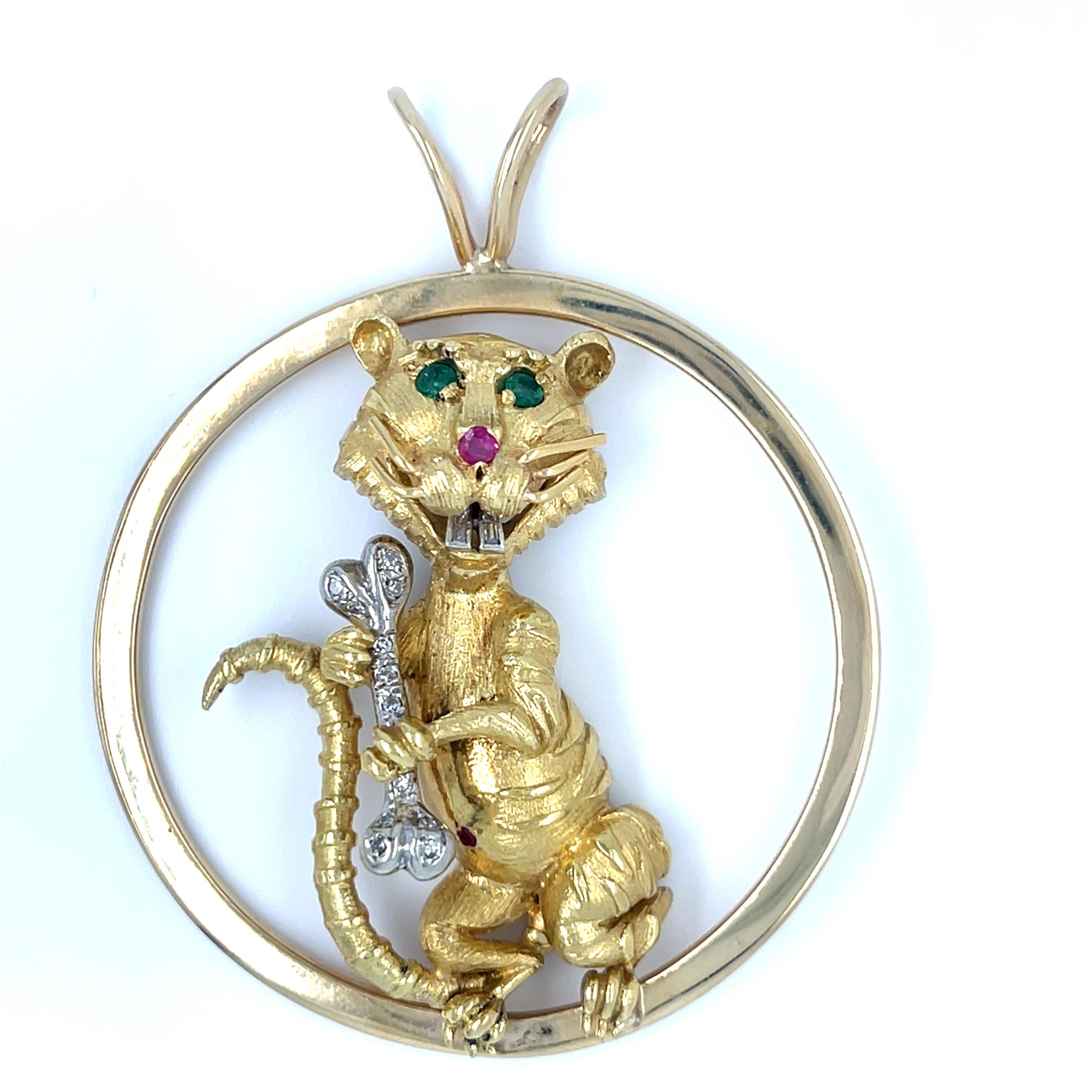 Creative Gold, Emerald, Ruby and Diamond Mouse Figural Pendant
Features a Mouse Design accented by round rubies and emeralds and detailed in round diamonds 
Features 0.15 ct Accent Diamonds
Includes Green Emerald Eyes and Ruby Nose (Appx 0.07 ct