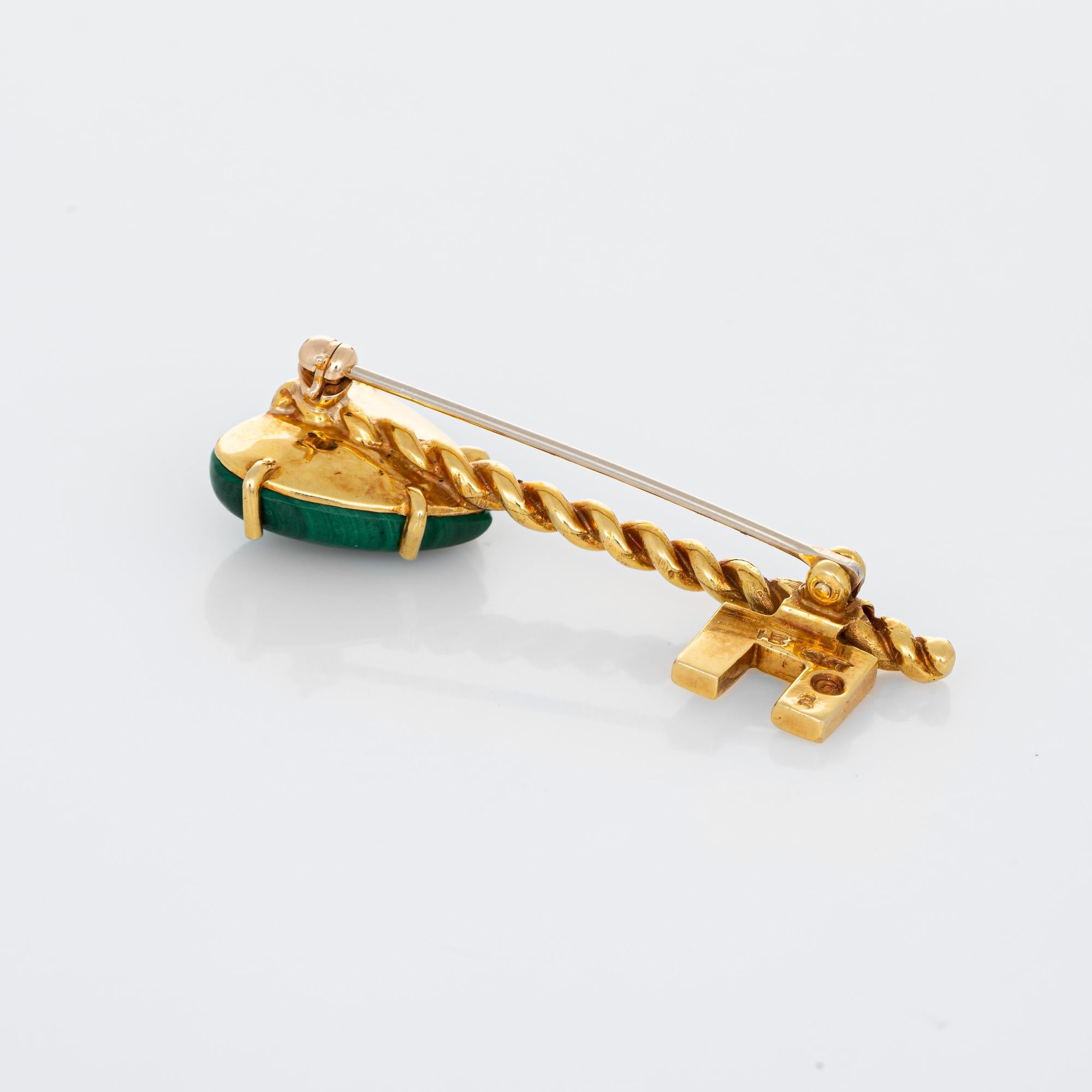 Finely detailed vintage Hammerman Bros malachite heart key brooch crafted in 18 karat yellow gold. 

Malachite measures 15mm (in excellent condition and free of cracks or chips). 

The 'Key to my Heart' brooch is set with forest green heart shaped