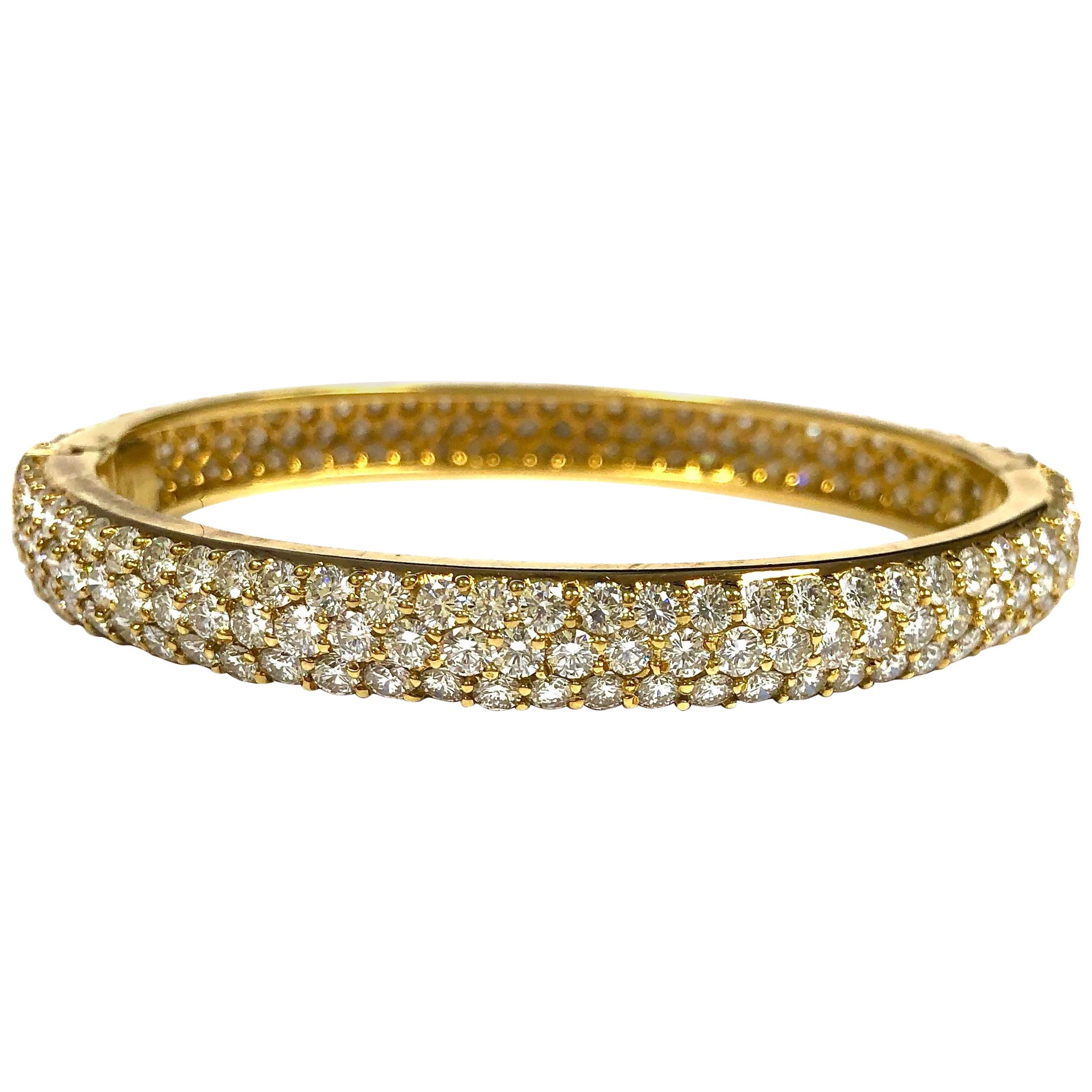 Magnificent diamond set hinged bangle bracelet by jewelry house of Hammerman Brothers. Pure perfection. Crafted in 18K yellow gold, bead set with 204 round brilliant cut diamonds. Total weight: 14.0 carats. Color: F-G, Clarity: