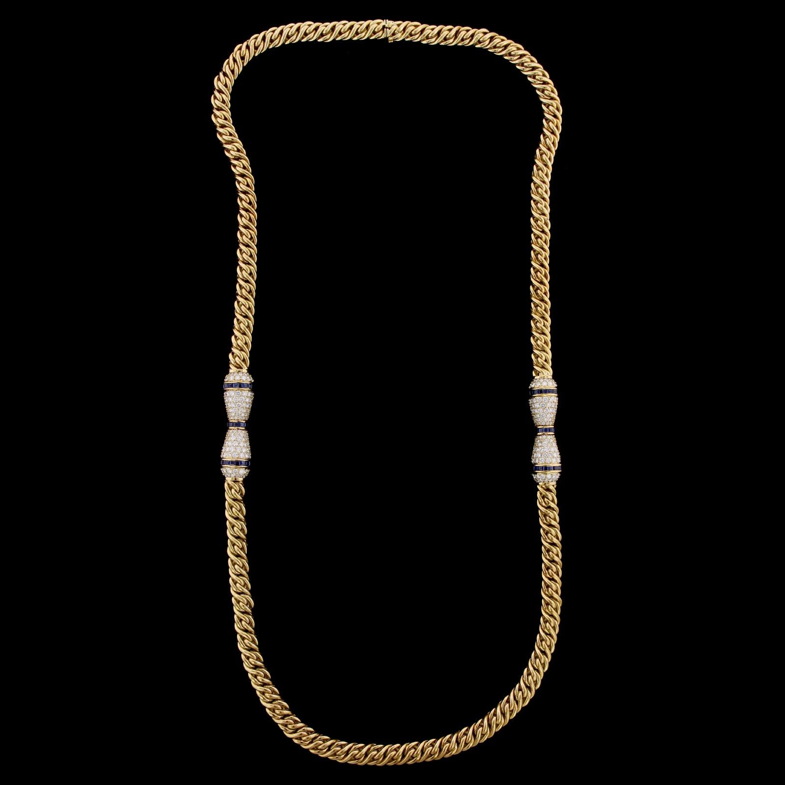 Hammerman Brothers 18K Yellow Gold Sapphire and Diamond Necklace. The necklace is designed with two stations pave set with 304 full cut diamonds, approx. total wt. 10.00cts., FG color, VS1 clarity, and 74 square cut sapphires, approx. total wt.