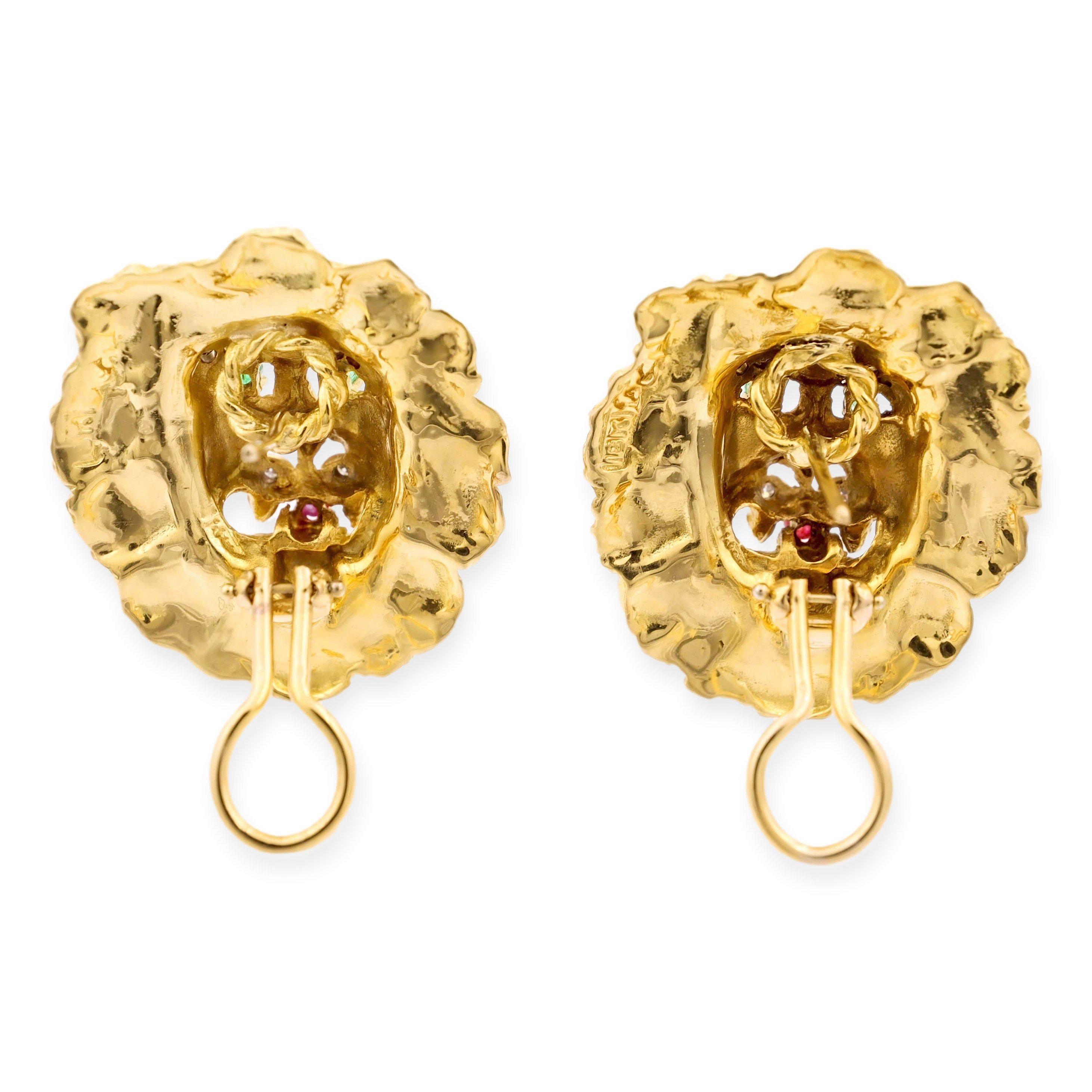 Iconic Lion motif earrings designed by Hammerman Brothers finely crafted in 18 karat yellow gold with a highly detailed gold finish adorned with single cut diamond eyebrows and whiskers. The eyes have inset round emeralds and the mouth holds