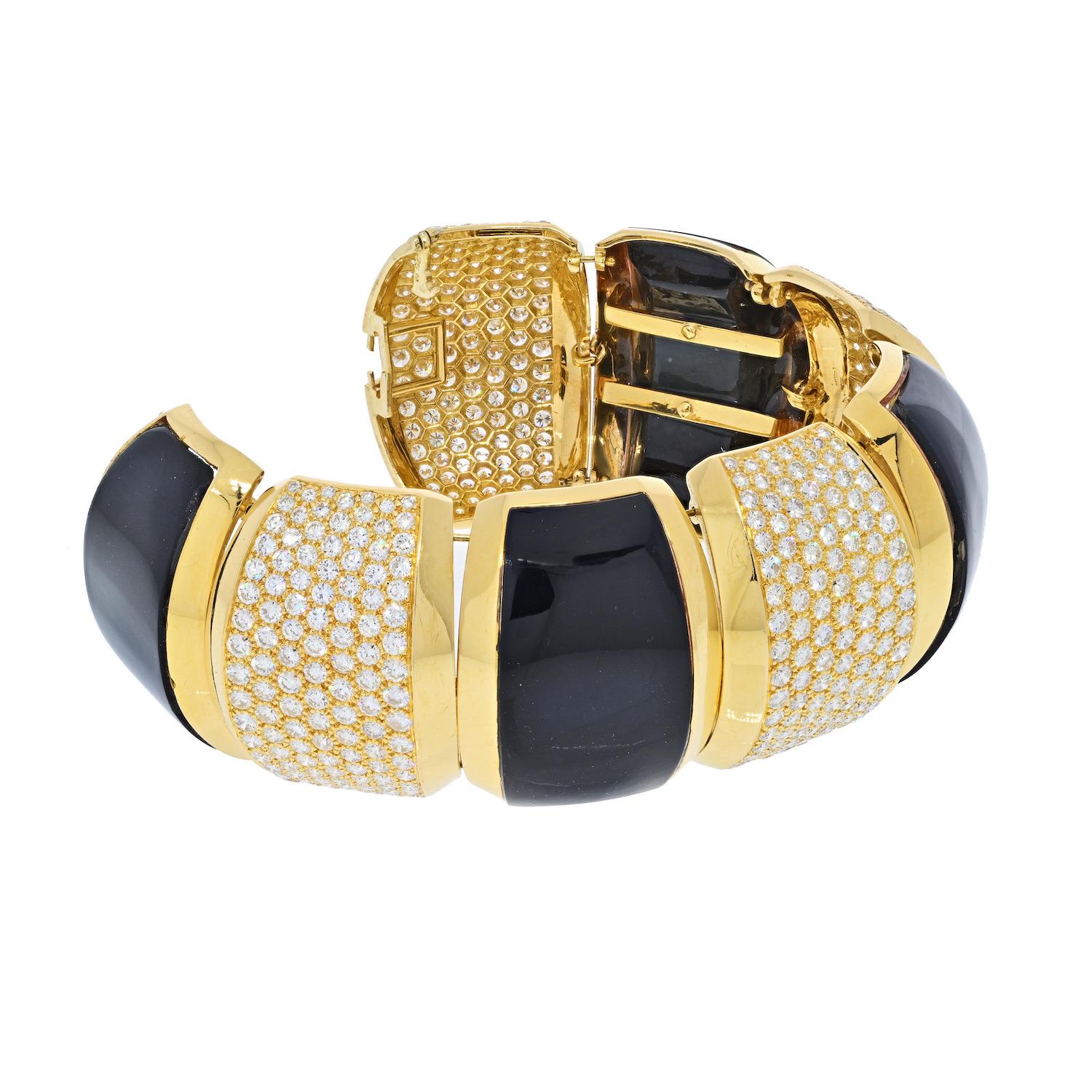 Vintage (c.1980s) chunky bracelet made of 18K Yellow Gold, diamonds and black agate. Hammerman Brothers. A substantial creation, rendered in 18 karat yellow gold with polished segments of agate together with sections set of brilliant white diamonds.