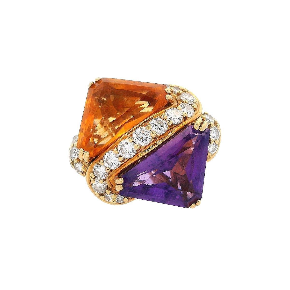 This gorgeous mid-century ring is a remarkable creation by the renowned American jewelry designer, Hammerman Brothers. Crafted in 18k yellow gold, it features two stunning triangle cut gemstones: a vibrant amethyst and a radiant citrine, each