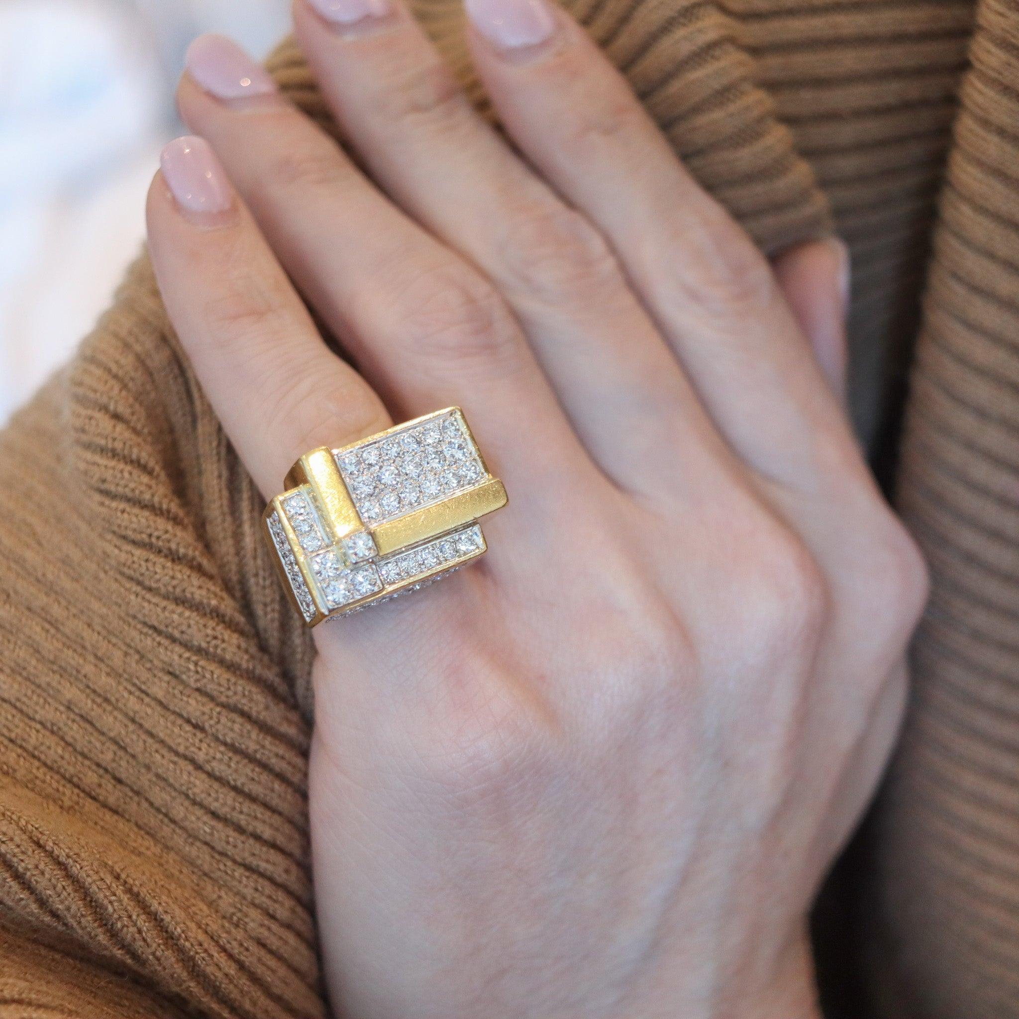 Geometric ring designed by Hammerman Brothers.

This is an exceptional geometric cocktail ring created in New York City by the American jewelry designers of Hammerman Brothers, back in the 1970. This fabulous ring was designed with bold geometric