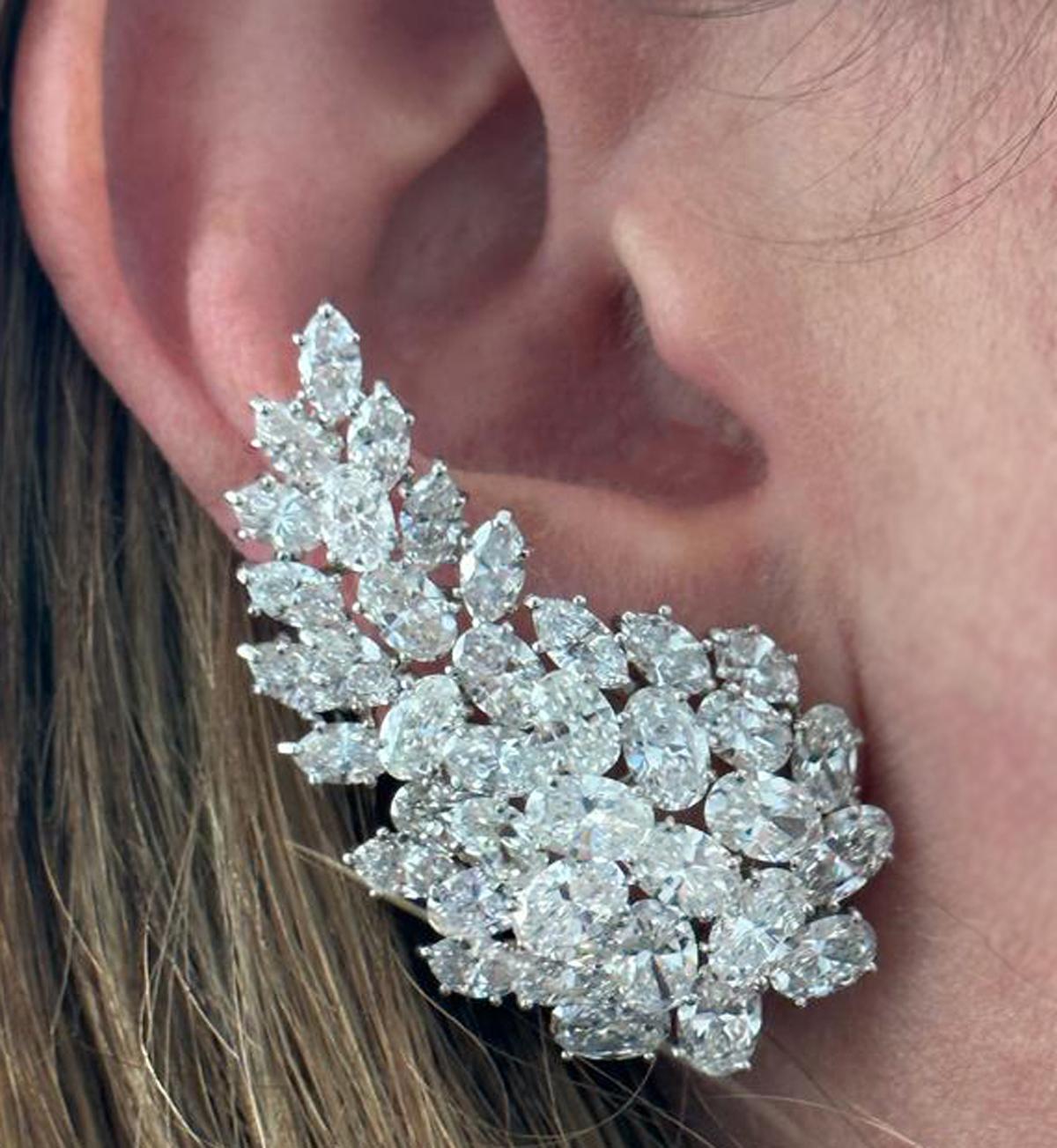 From the esteemed House of the illustrious Hammerman Brothers, these earrings stand as a testament to the art of fine jewelry creation. Exquisitely and meticulously hand-crafted in platinum, they magnificently showcase diamonds of both oval and