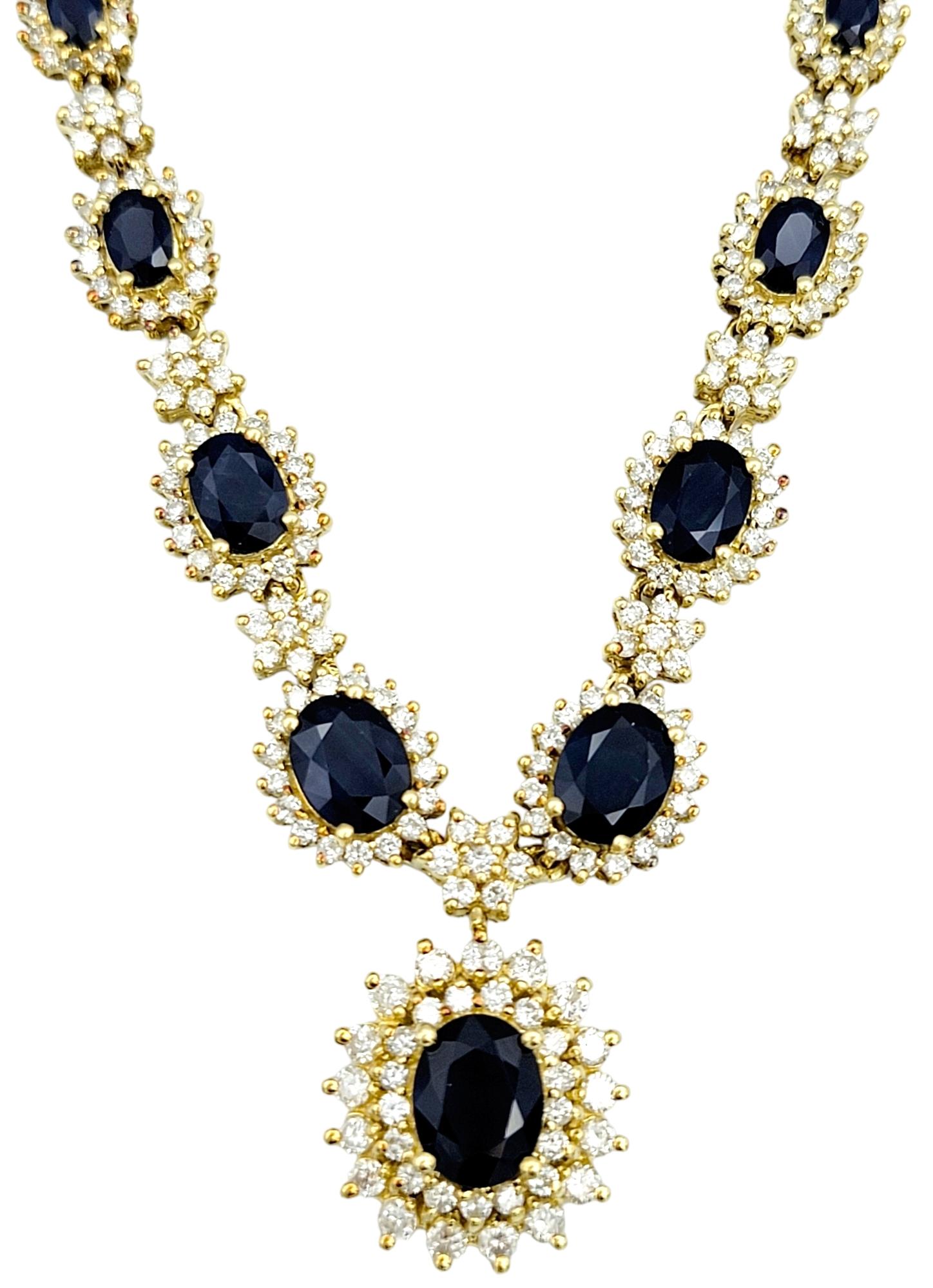 This exquisite diamond and sapphire pendant necklace set in 18 karat yellow gold is a true work of art that exudes timeless elegance and luxury. The pendant, with its stationary design, serves as the focal point of this jewelry piece. At its heart