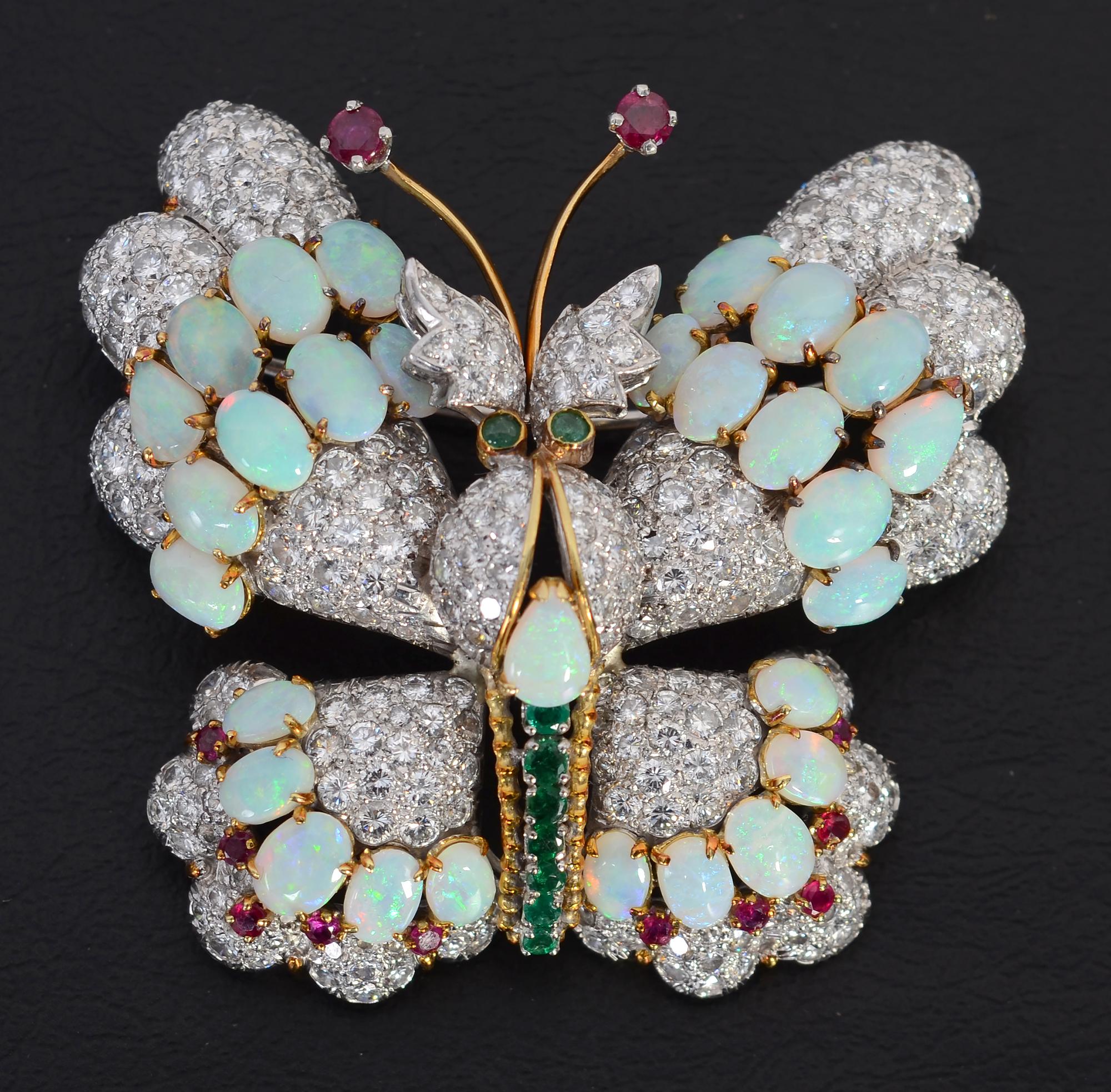 Exquisite, elegant butterfly brooch by Hammerman Brothers. The brooch consists of 282 diamonds weighing a total of approximately 5 carats; opals; emeralds and rubies. The opals are very effective in conveying the iridescence of butterfly wings. The