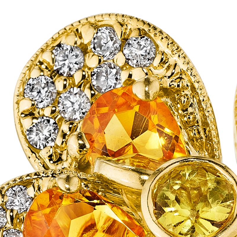 A festive flower ring that glitters with even the slightest movement of the hand. Beautiful citrine petals are complemented by pave diamond set edges and a center of bezel-set citrines. The citrine center features a special setting that allows the