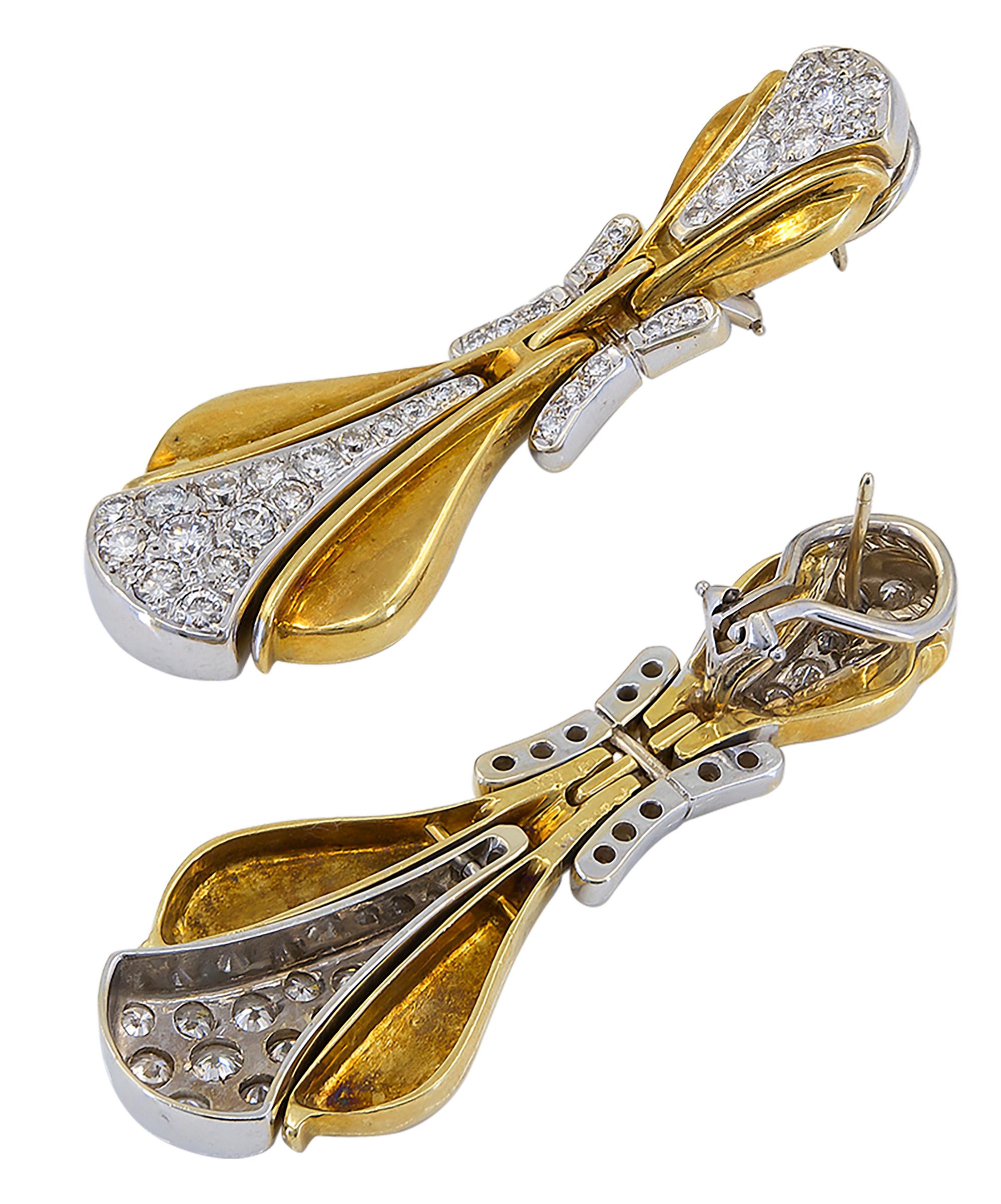 Beautiful 18k yellow and white gold door knockers earrings set with round diamonds.
Stamped H for Hammerman Brothers. Serial #7565.
Gold weighs 34.65 grams.
Length of the earrings is 2.2 inches (5.6 cm).

