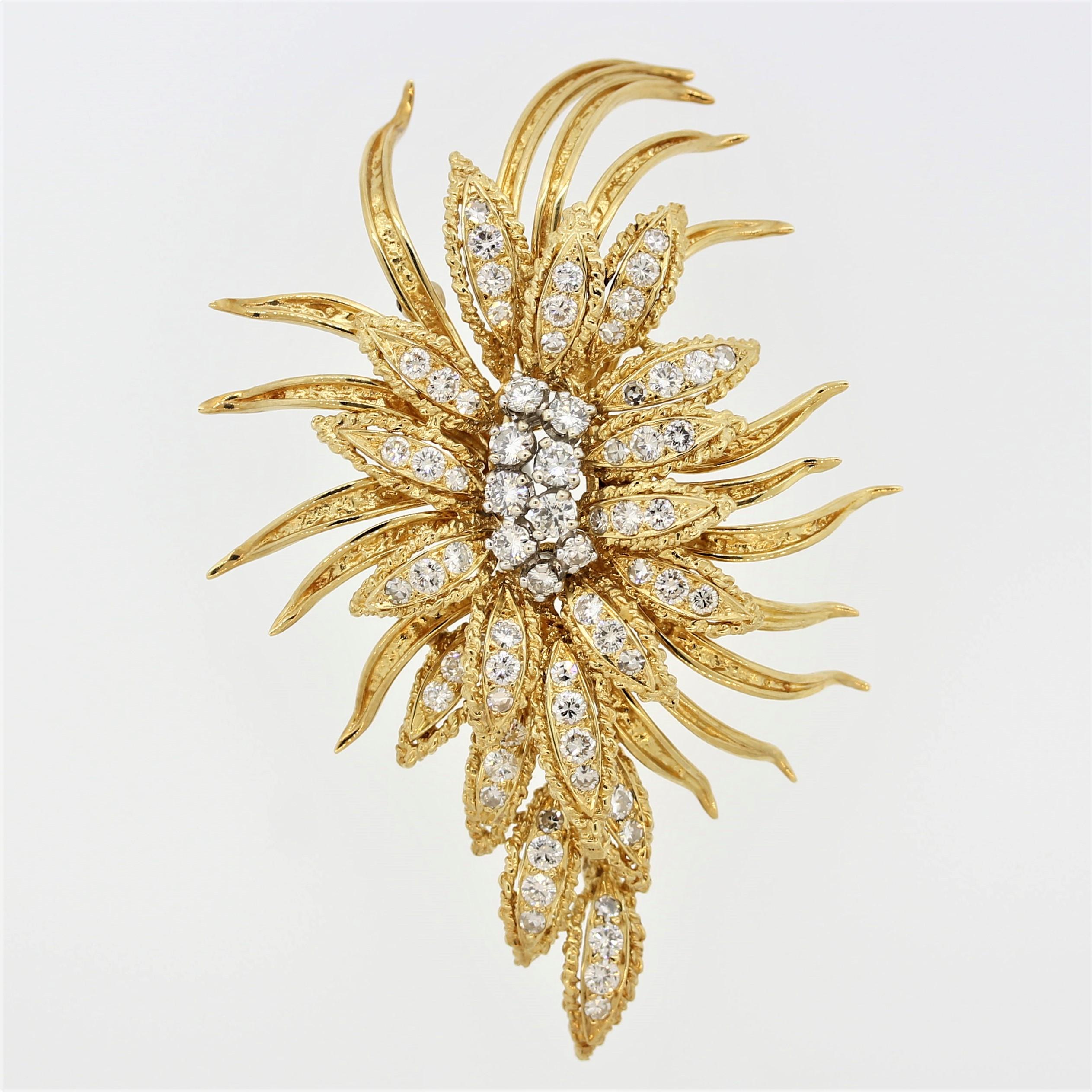 A classic diamond spray brooch from famed designer Hammerman. It features 3.50 carats of extra fine round brilliant cut diamonds which are set over a floral motif. The spray design adds dimension and style to this unique brooch. Made in 18k yellow
