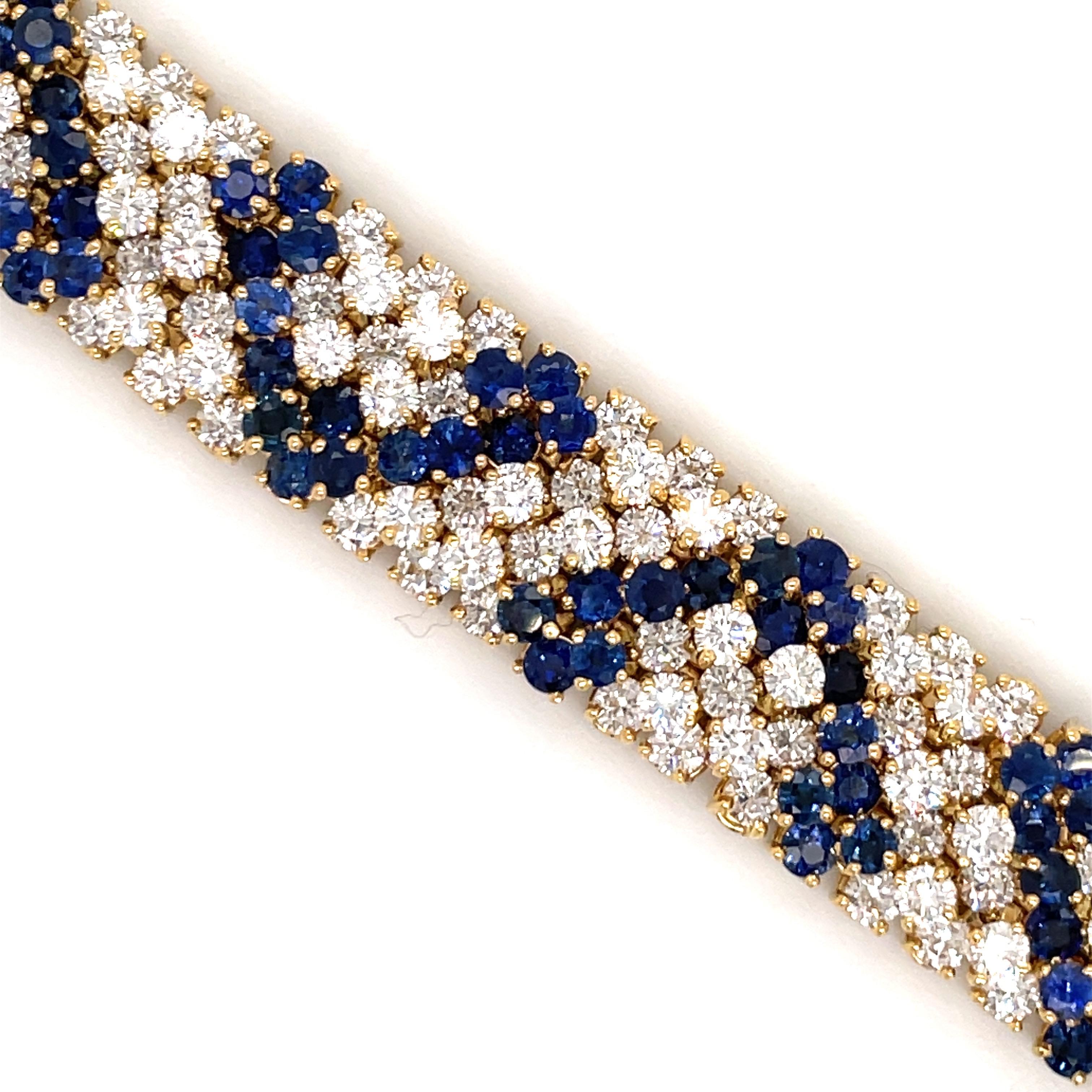 Hammerman Brothers flexible bracelet featuring 198 round brilliants weighing approximately 17 carats and 128 Vivid Blue Sapphires weighing approximately 18 carats, crafted in 18 Karat Yellow Gold 