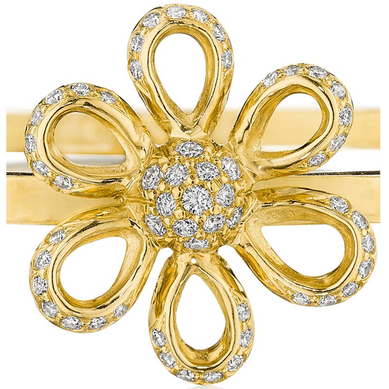 A festive flower bracelet that blends perfectly with an armful of bangles. Dusted with pave diamonds, the open playful petals offer wearability reminiscent of a spring day. The full pave center will attract attention, much like a honey bee would be