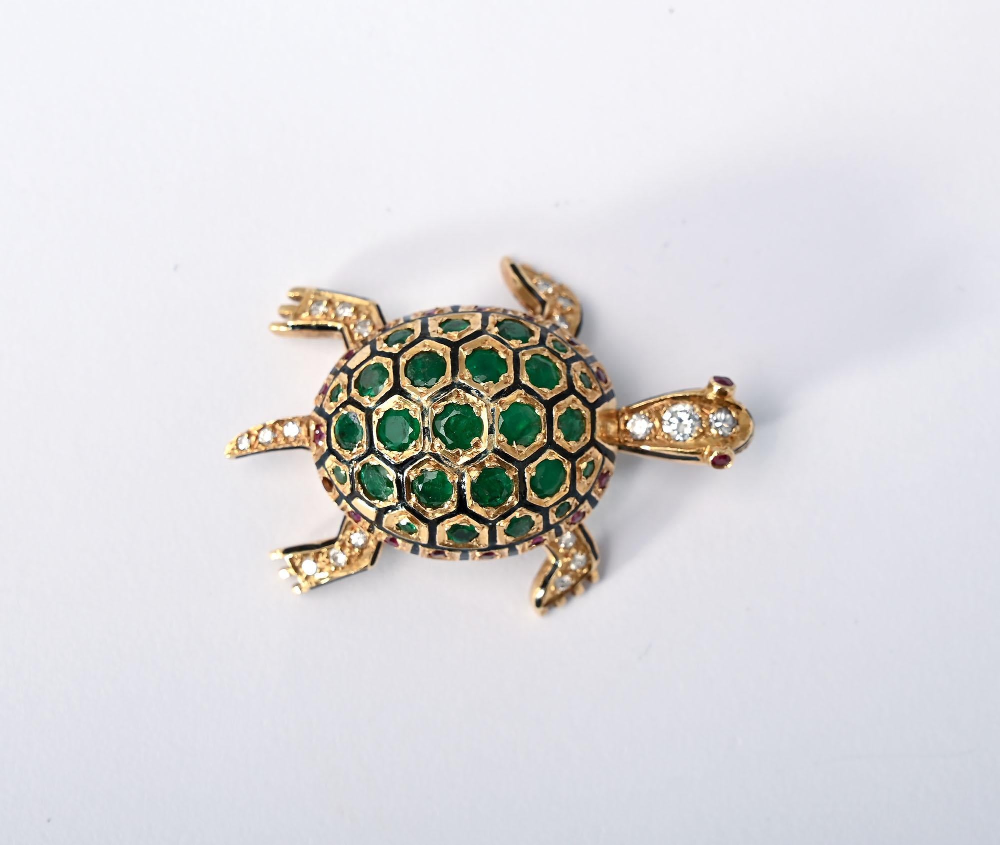 Charming turtle brooch with fine detail by Hammerman Brothers. The shell of the turtle is covered with emeralds. The head; legs and tail are covered with diamonds. The outer rim of the shell and the eyes are done with rubies.
The brooch measures 1