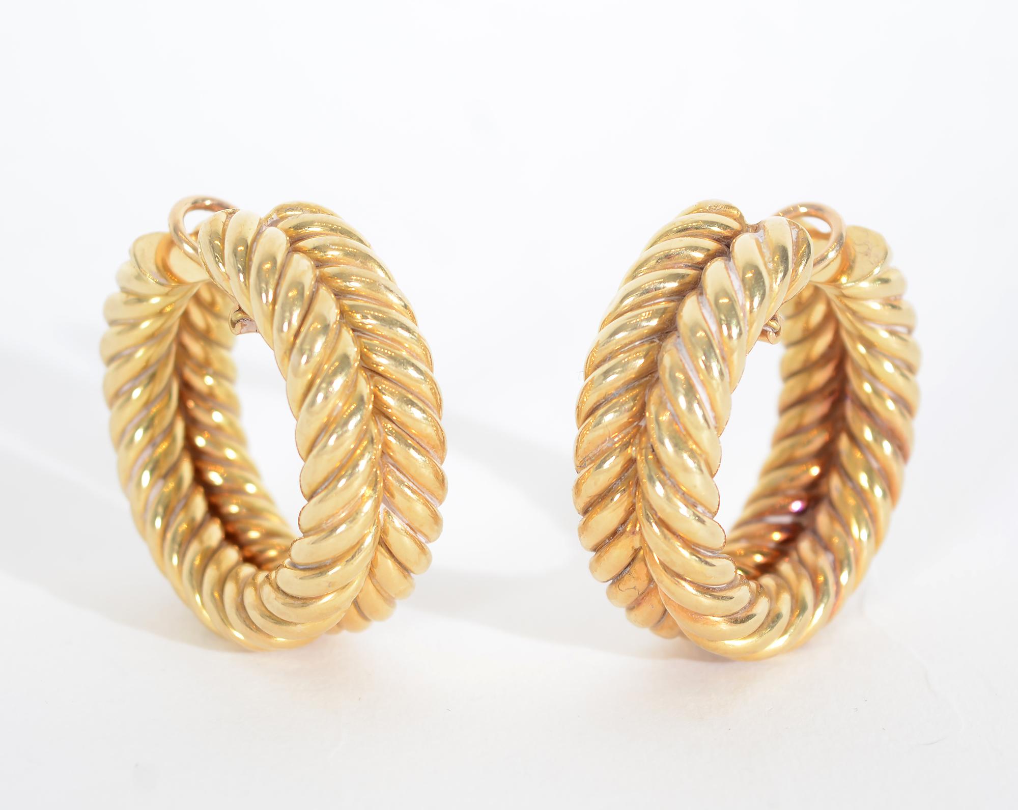 These twisted gold hoop earrings by Hammerman Brothers are bold and beautiful. They measure 1 1/2 inches in length.The double rows of twisted gold are 1/2 an inch wide.. Clip backs can be converted to posts. 