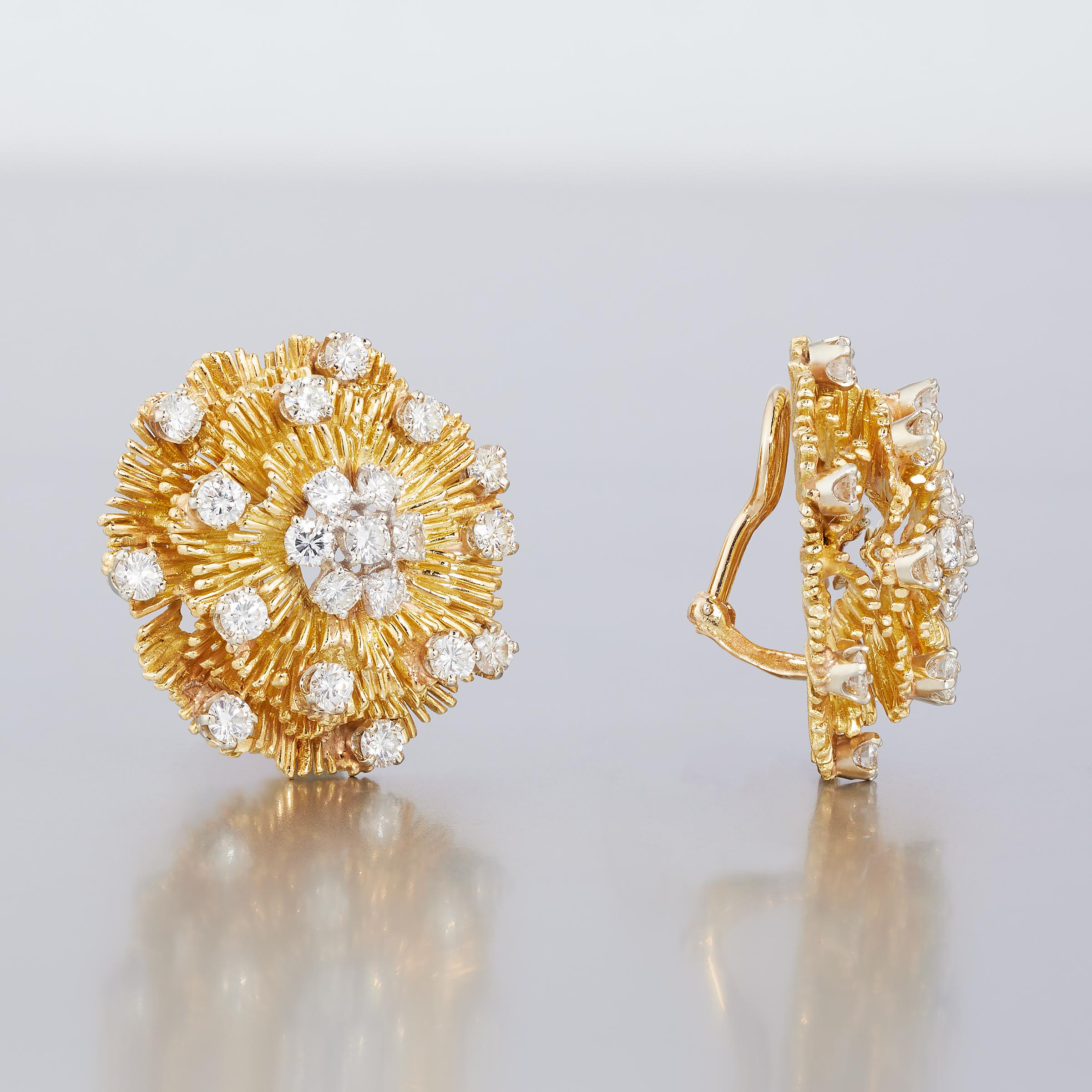 Exceptional pair of mid-century Hammerman Brothers earrings radiating with sparkle of approximately 5 carats of high-quality diamonds sprinkled across a finely textured and multi-layered 18 karat yellow gold flower base. A wonderful example of