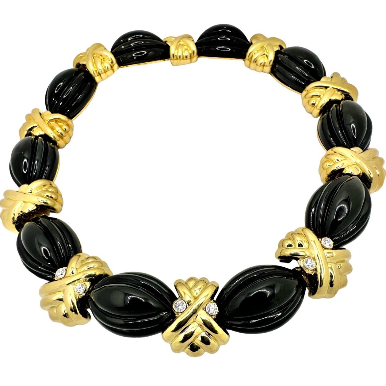 This striking 18k yellow gold and fluted, black onyx cocktail necklace is a creation of the very highly regarded New York jewelry manufacturer, Hammerman Brothers.  This necklace has a continuous length of billowing black onyx cabochons connected by