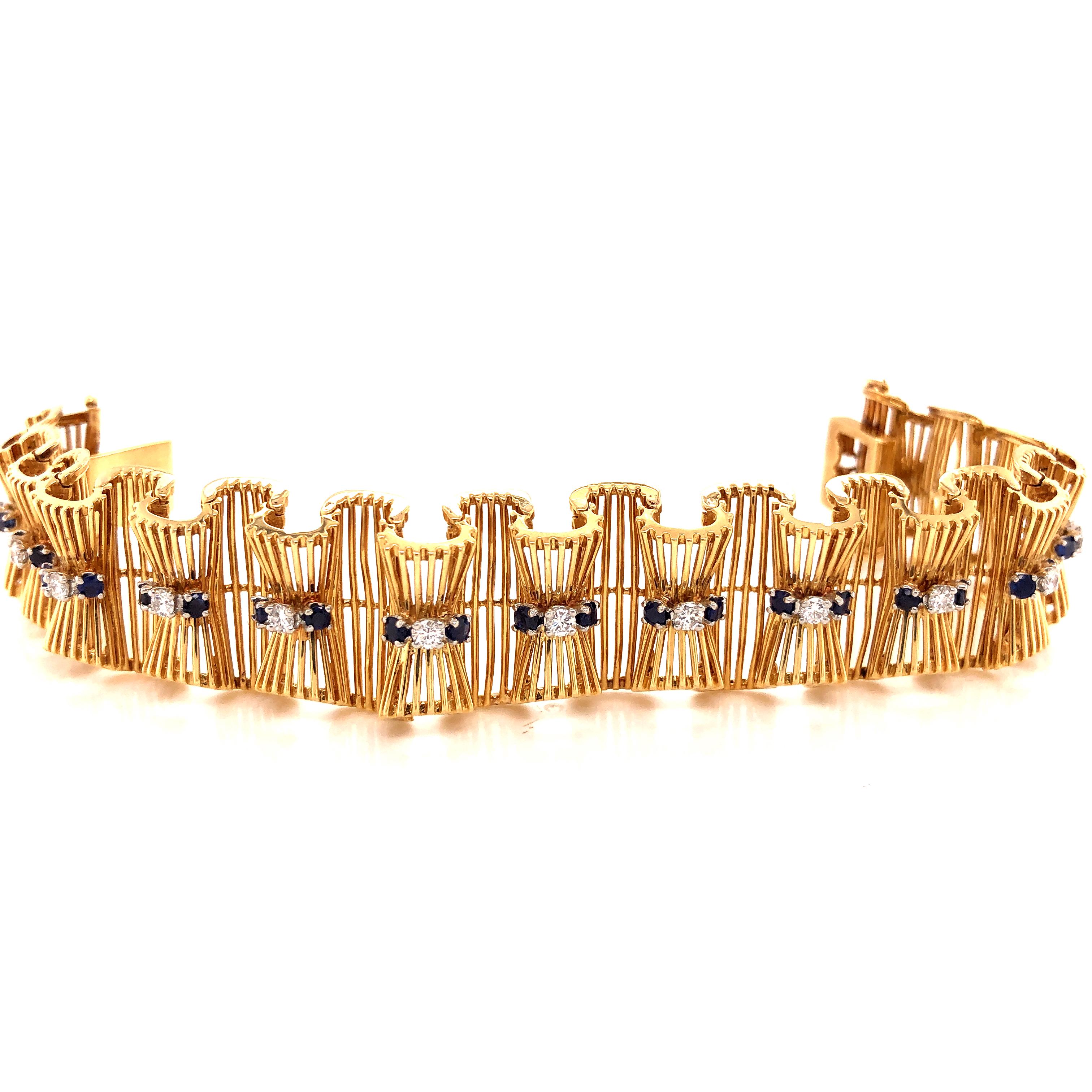 Amazing design on this vintage treasure by Hammerman Bros. The bracelet is crafted in 18k yellow gold  with details seen throughout. The bracelet displays a ribbon design with a silky wave link pattern. The bracelet shows amazing craftsmanship. The