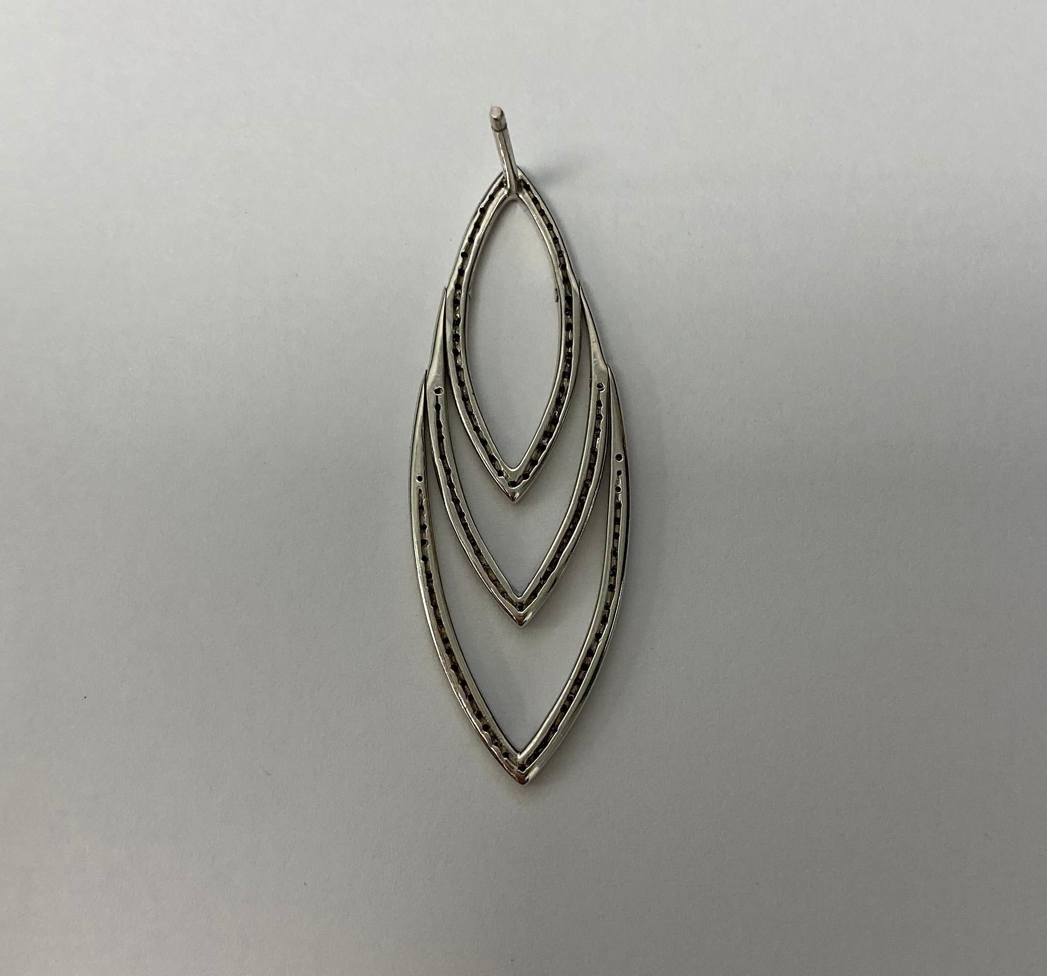 18 karat white gold diamond leaf stud earrings. 230 diamonds for 0.53 carats.