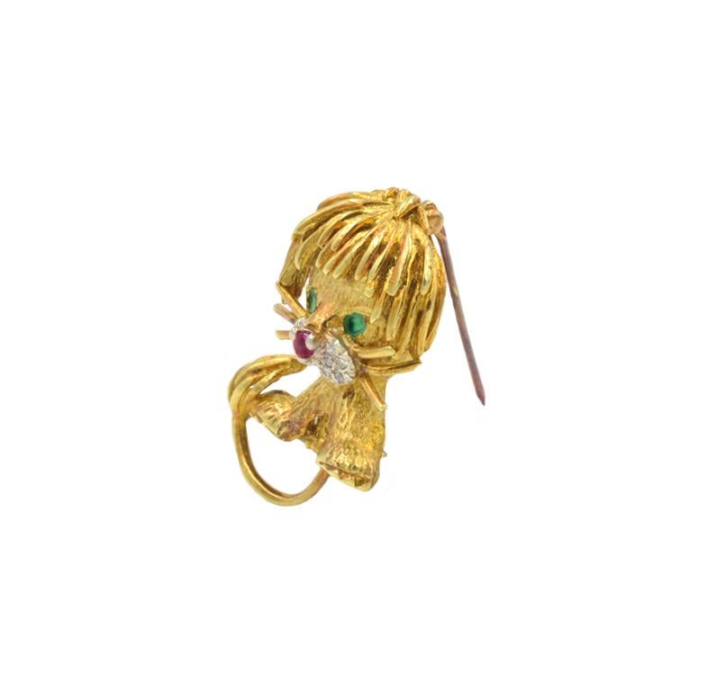 Whimsical Hammerman Lion in 18k yellow gold with 10 single cut diamonds, emerald eyes and ruby nose. 1.25 inches tall. Circa 1960s