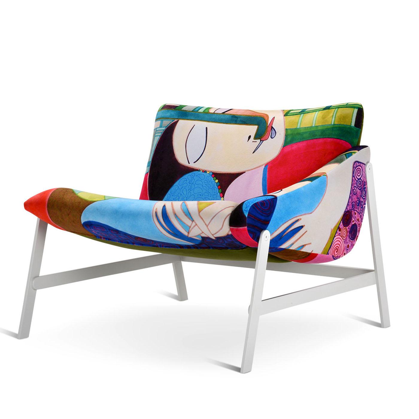 A colorful Picasso-inspired fabric exclusively designed by Le Clochart for Adrenalina lends this armchair its exceptional artful personality. The human figure emerging from the cover transforms into friendly company for those sitting down, welcoming
