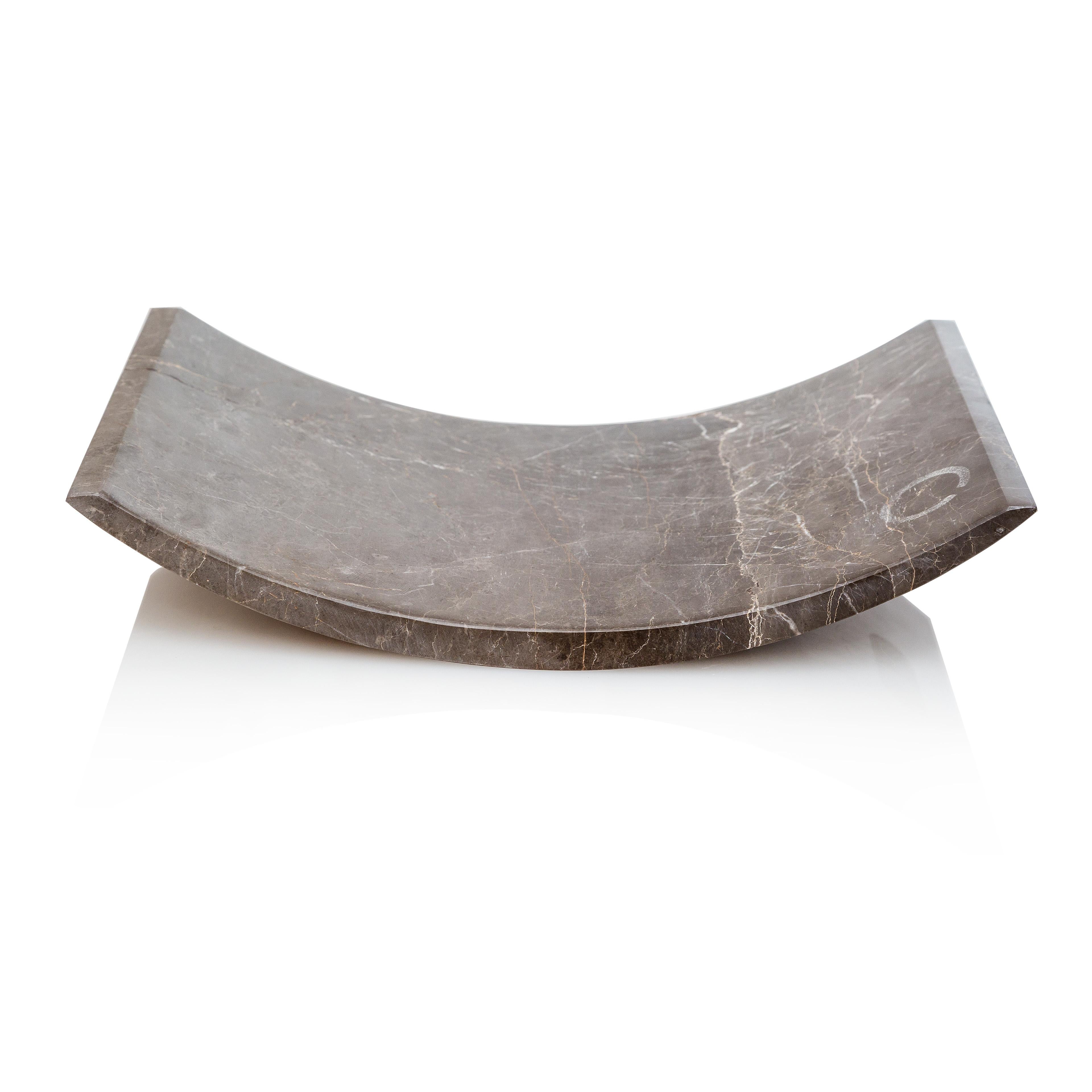 This platter is designed as a homogeneous volume, wishing to engage the senses around the plasticity of marble. It is carved off a single piece of marble without joints or seams. 

Hammock platter has a fine mat finish, revealing the unique color