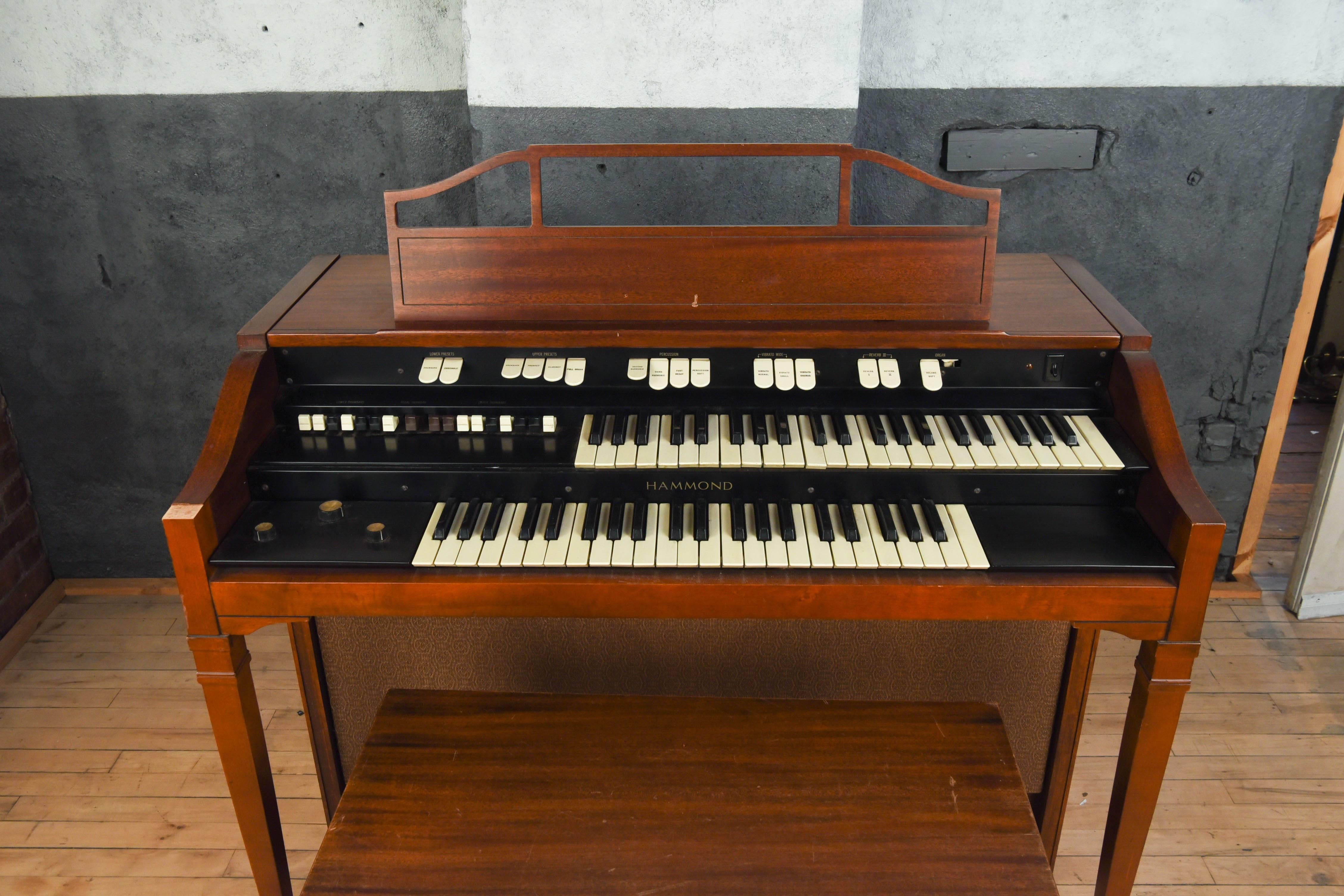 Vintage tube or tone wheel Hammond organ. Excellent sound. Has psychedelic percussion effect board, added speaker jack output (auto switching jack, disconnects built-in speakers when plug is inserted) for added versatility in studio. Includes