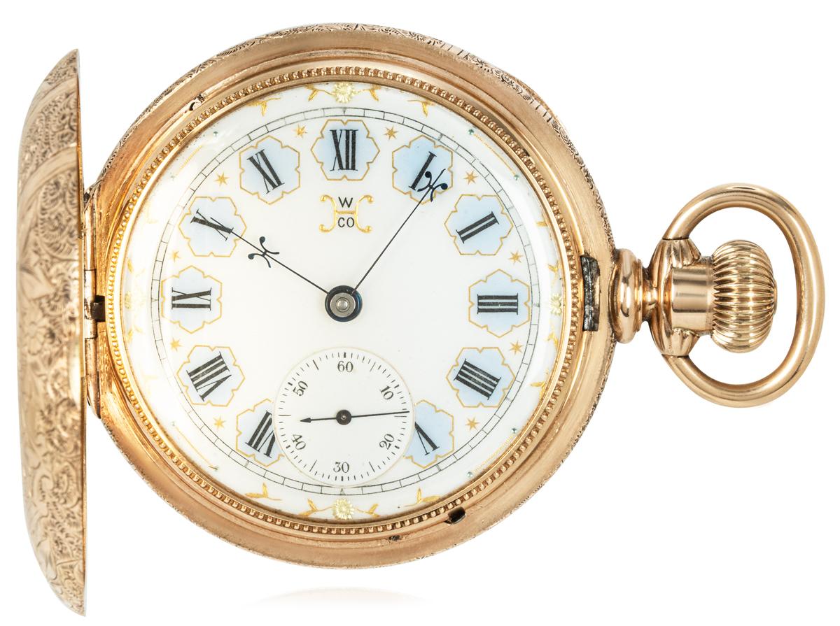Hampden Watch Co. A Highly Engraved Heavy 14ct Gold Full Hunter Keyless Lever Railroad Pocket Watch C1890

Dial: A beautiful glass enamel dial with Roman numerals set in sky blue chapter rings with the dial signed with a Gold H W Co. The subsidiary