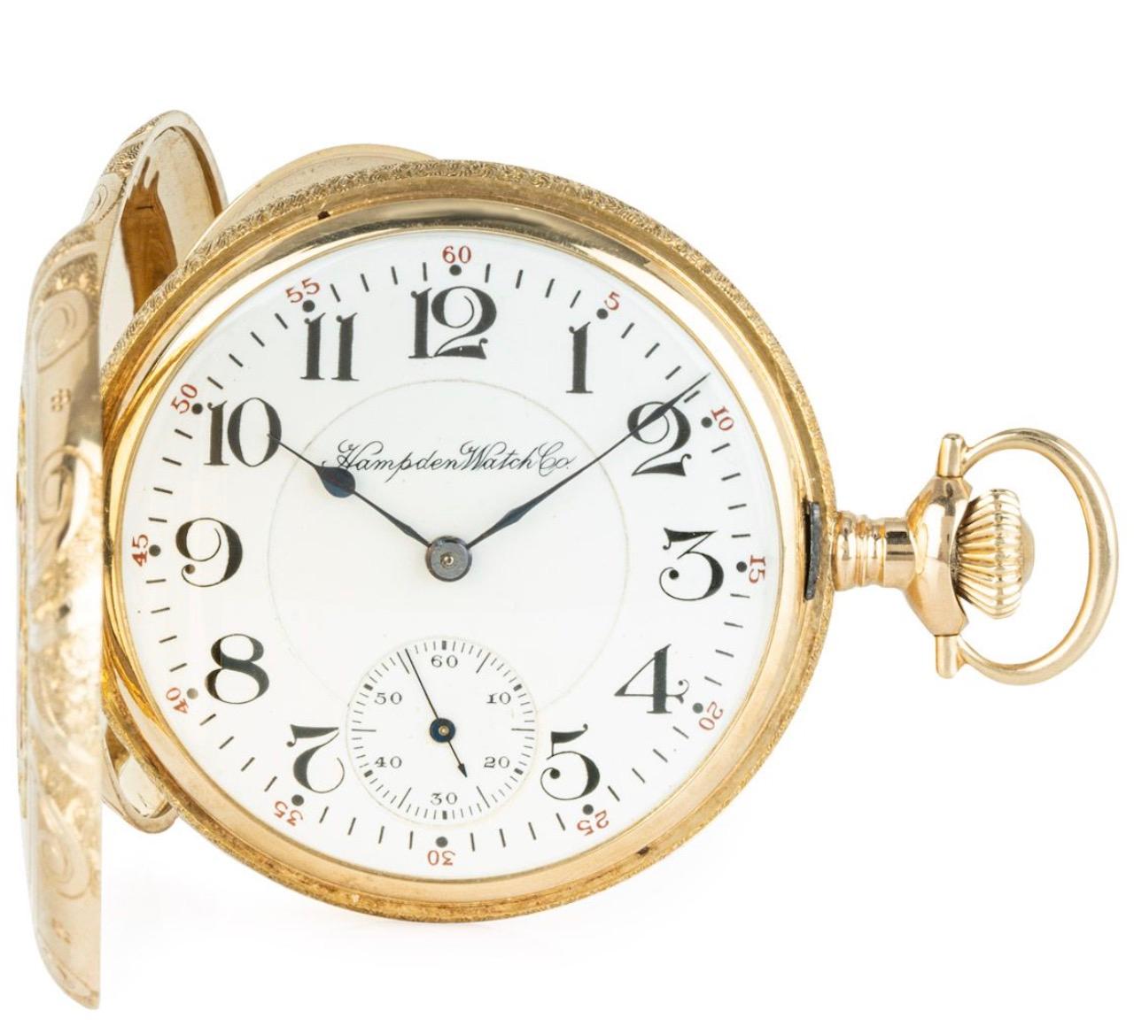 Hampden Watch Company, A 14ct multi coloured gold keyless lever full hunter pocket watch, C1890.

Dial: A beautiful condition white enamel dial with large Art Nouveau Arabic numerals with outer minute track and red Arabic five minute interval